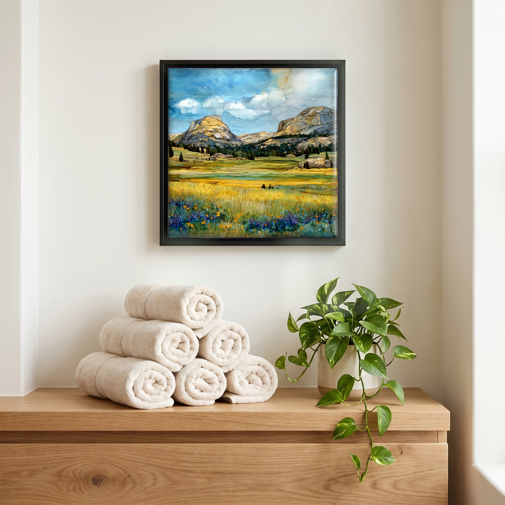Above the linens, in a slim black surround.