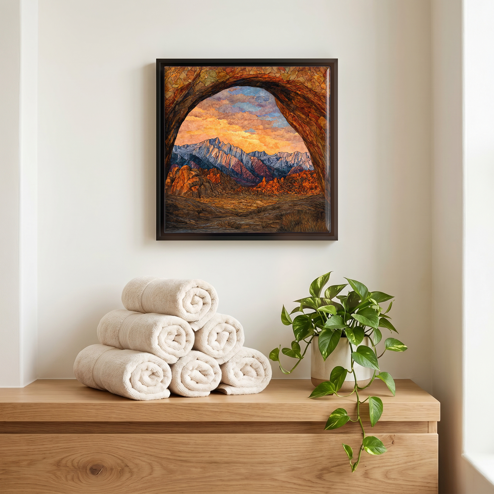 Above the linens, in a slim black surround.