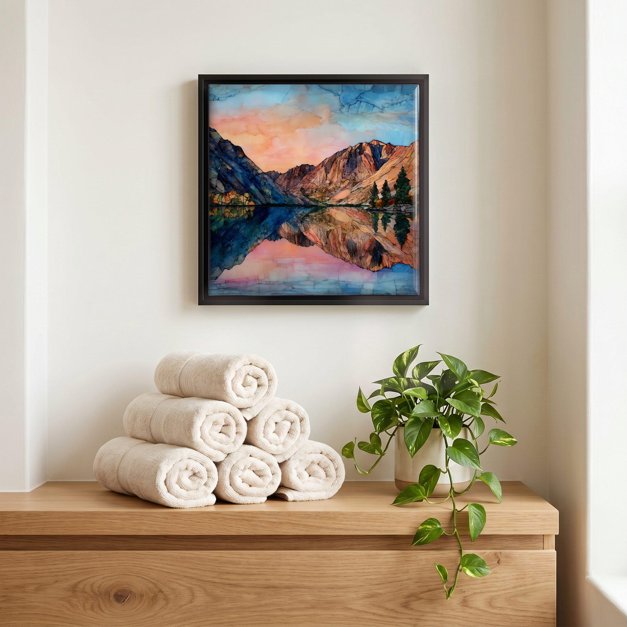 Above the linens, in a slim black surround.