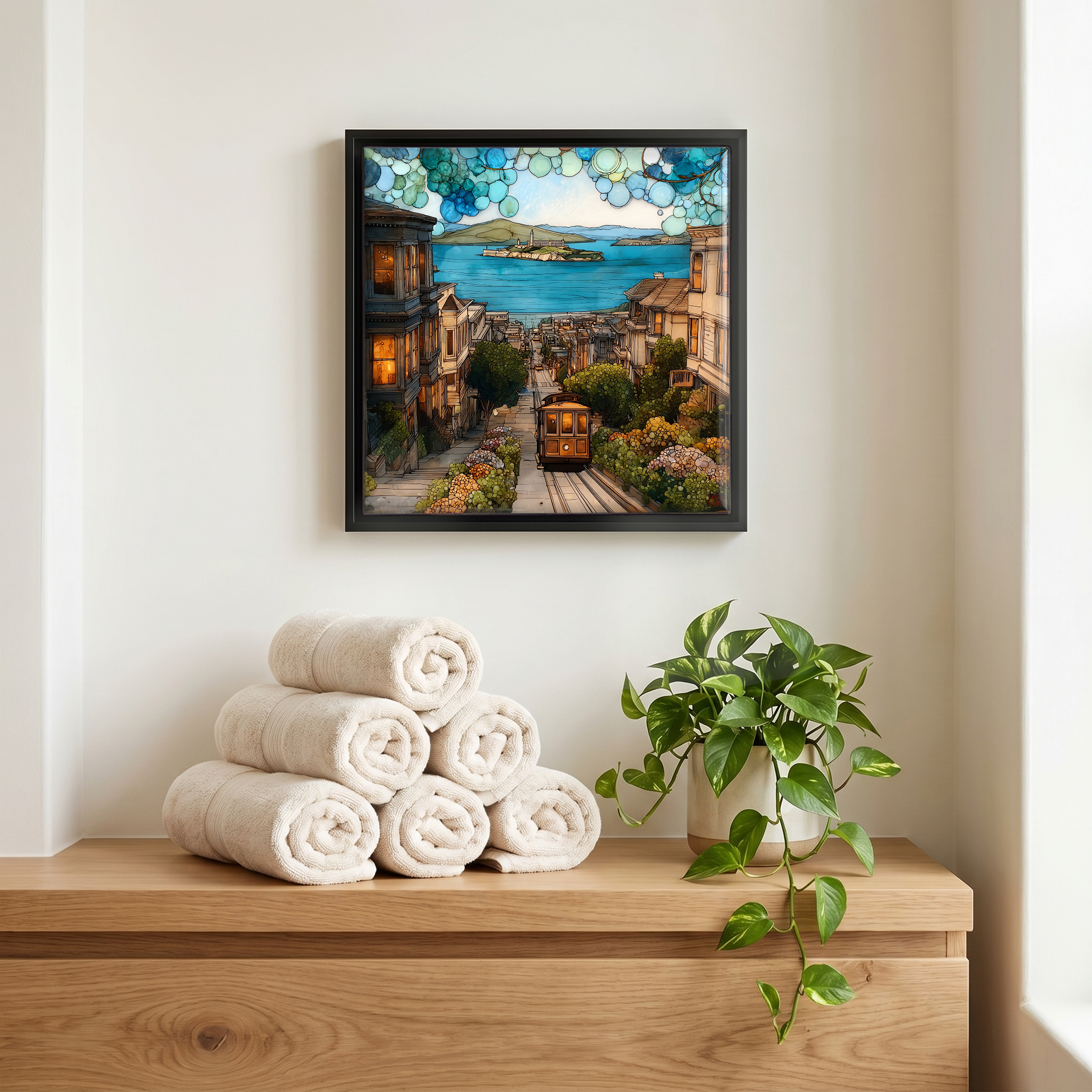 Above the linens, in a slim black surround.