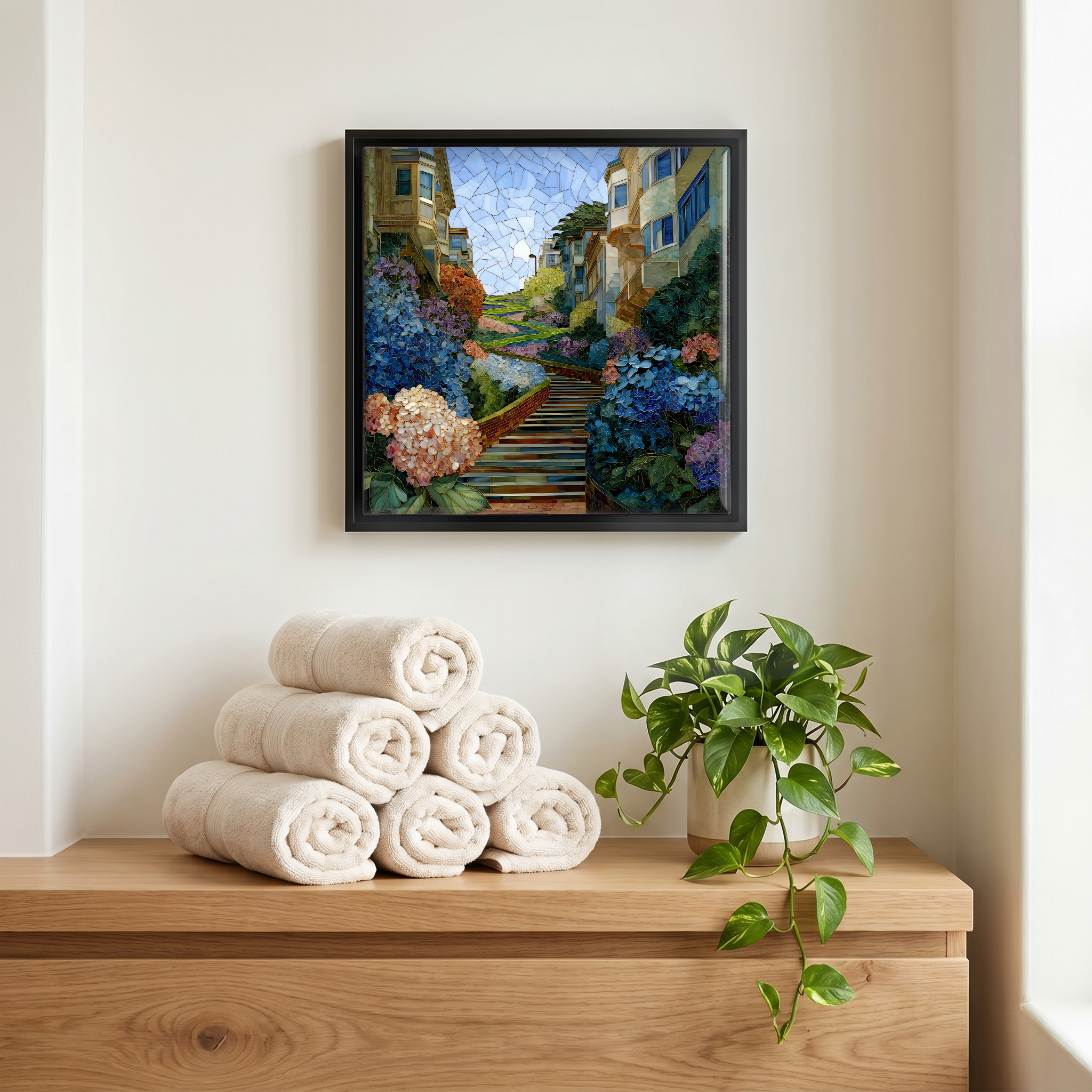 Above the linens, in a slim black surround.