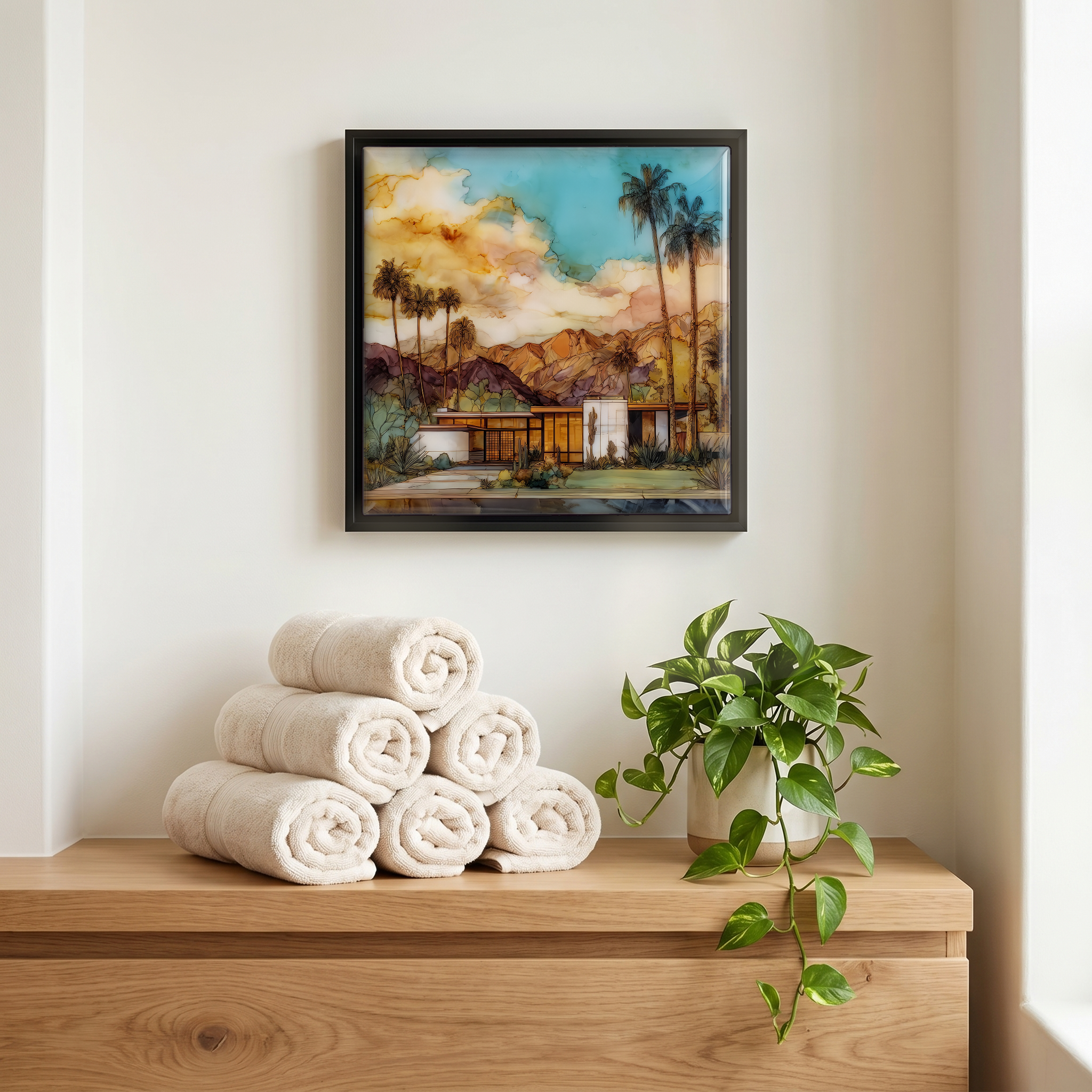 Above the linens, in a slim black surround.