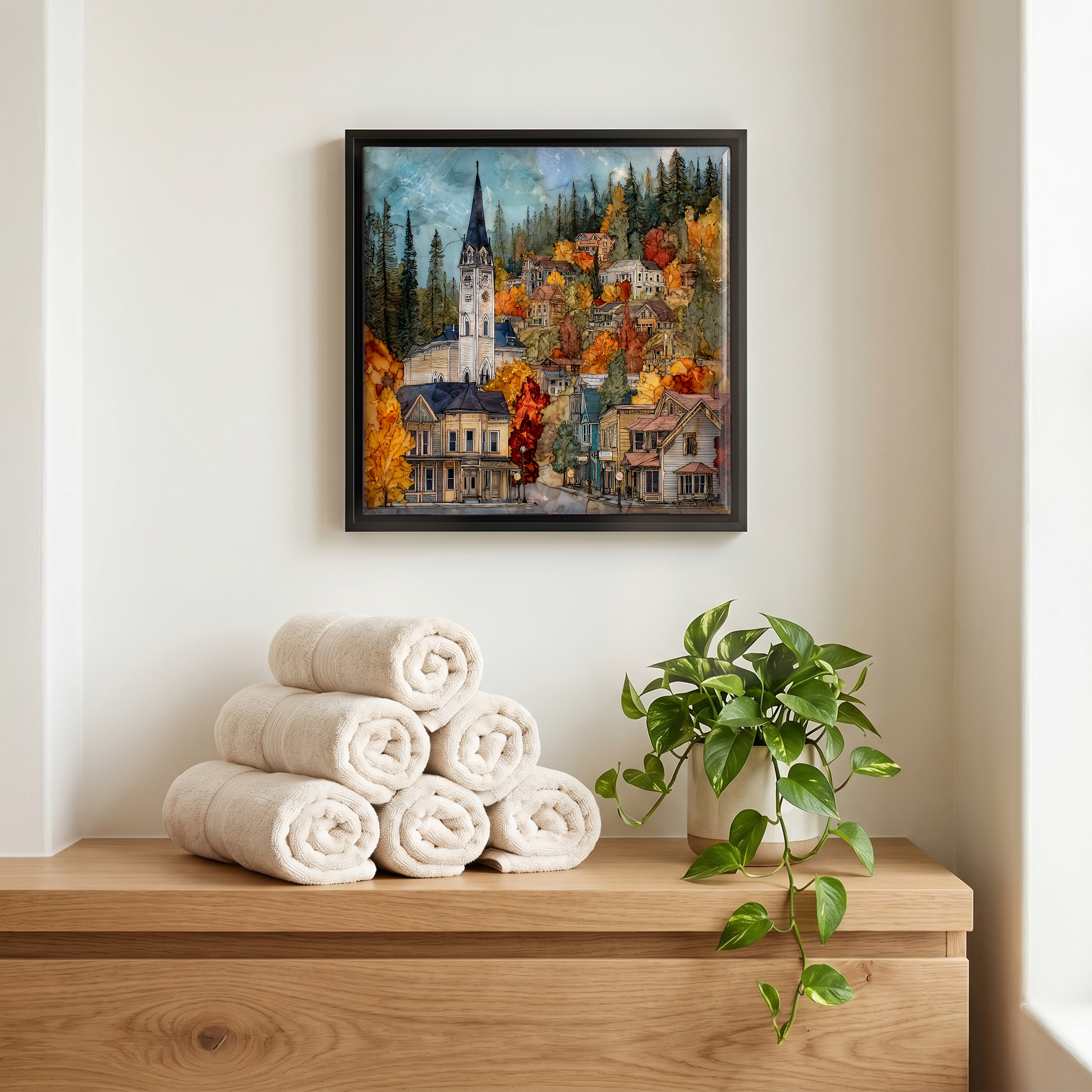 Above the linens, in a slim black surround.
