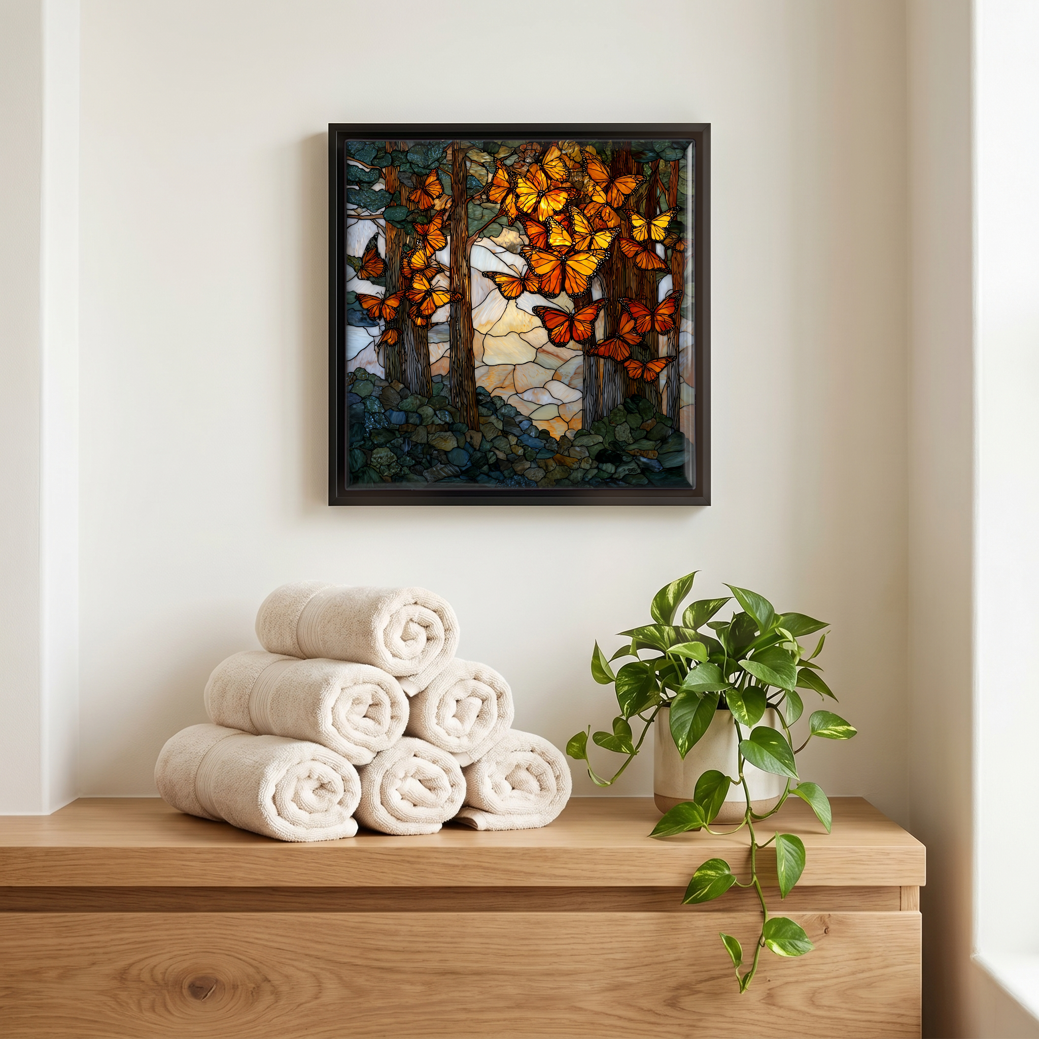 Above the linens, in a slim black surround.