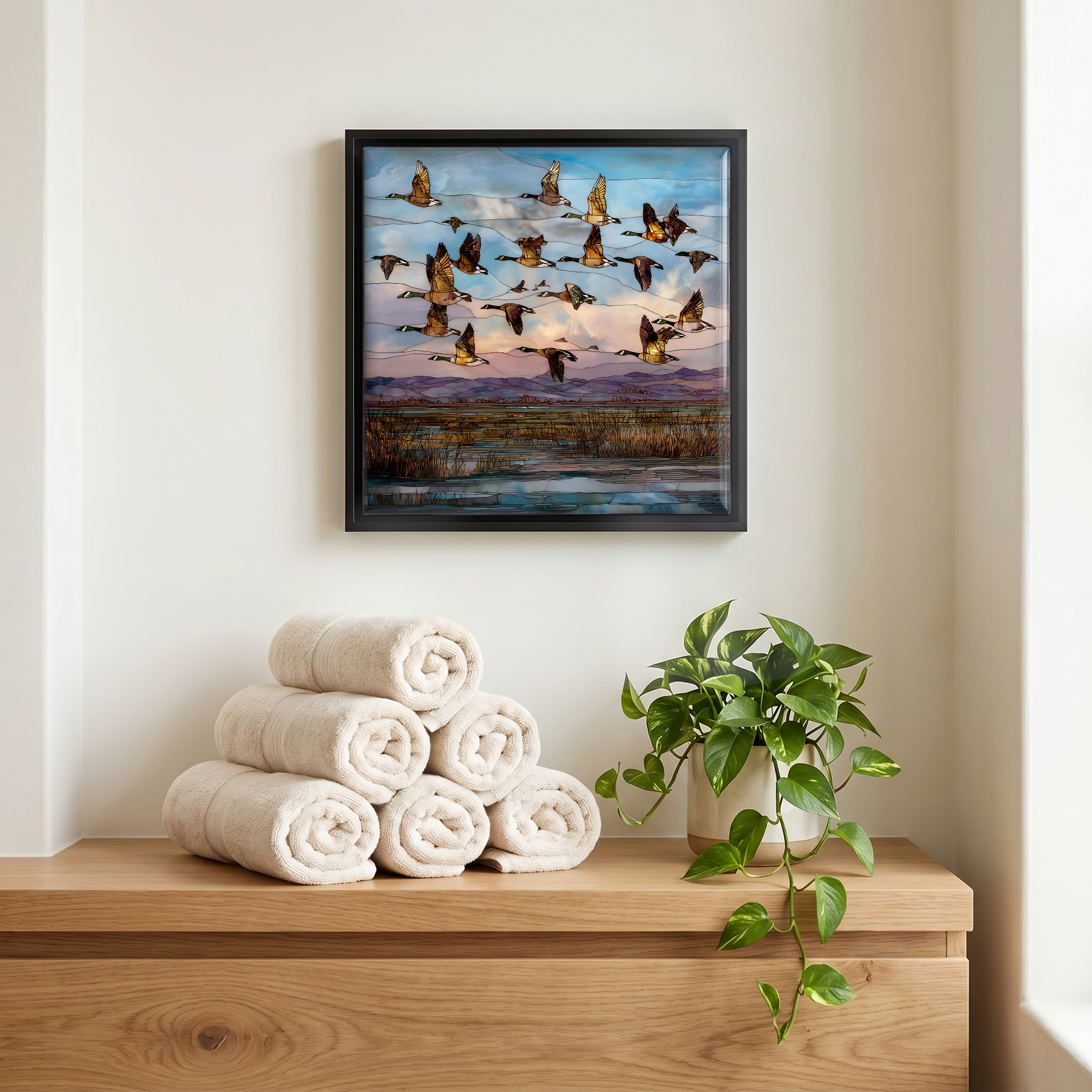 Above the linens, in a slim black surround.