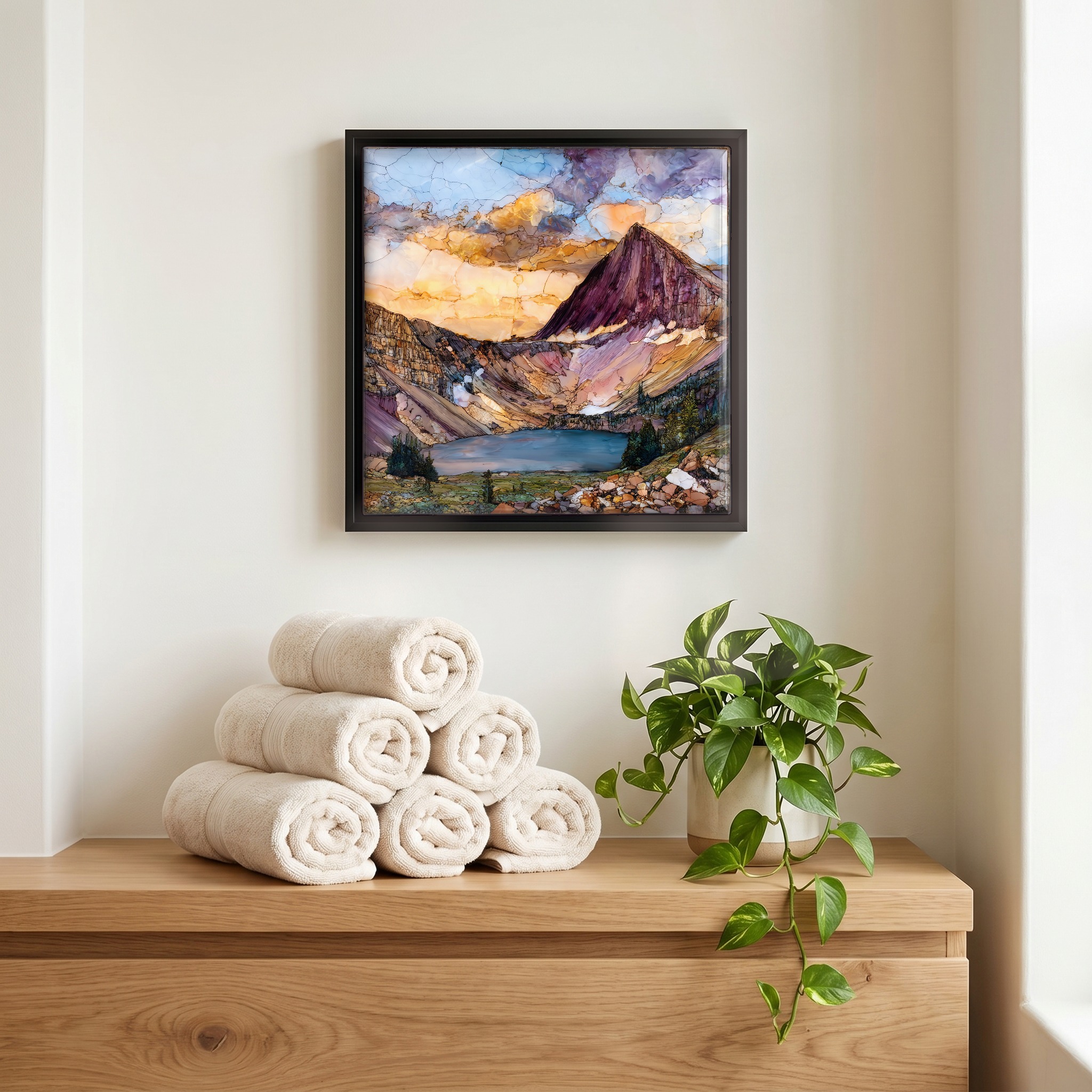 Above the linens, in a slim black surround.