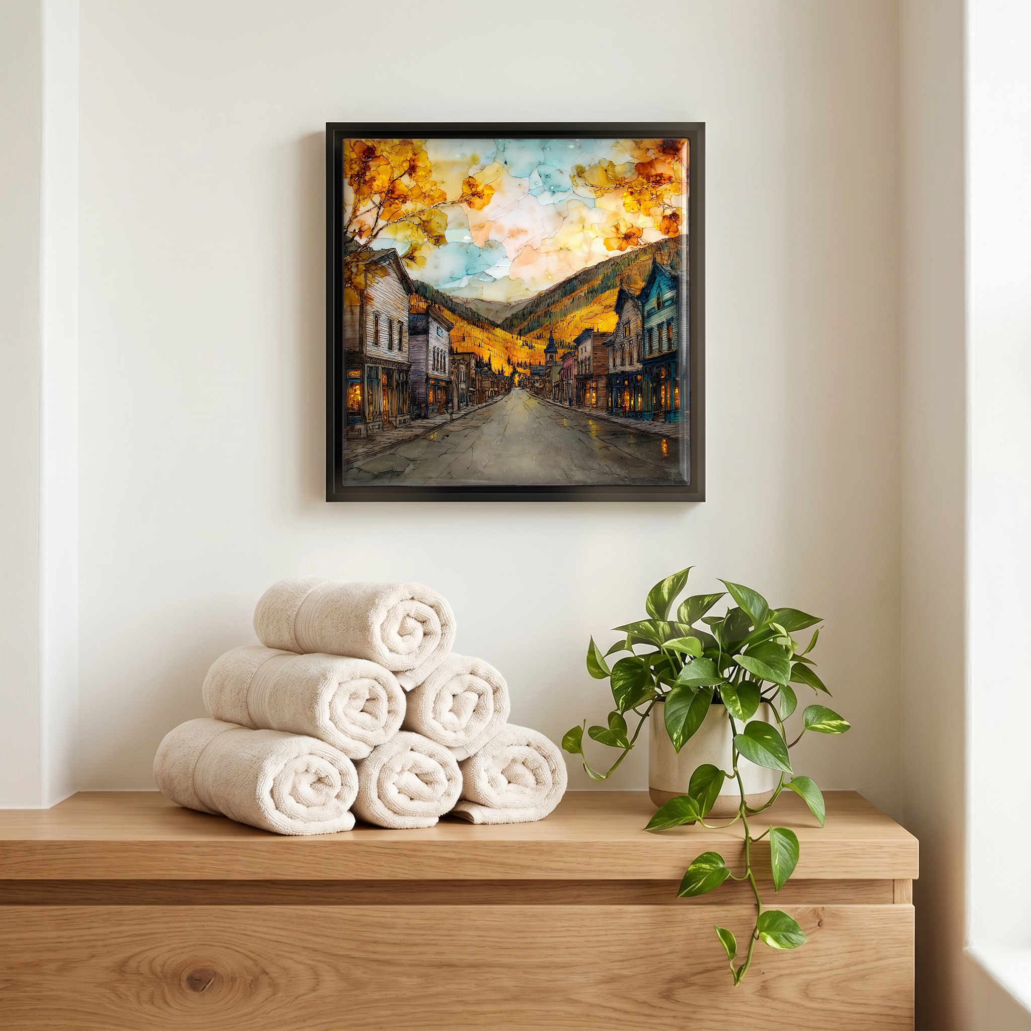 Above the linens, in a slim black surround.