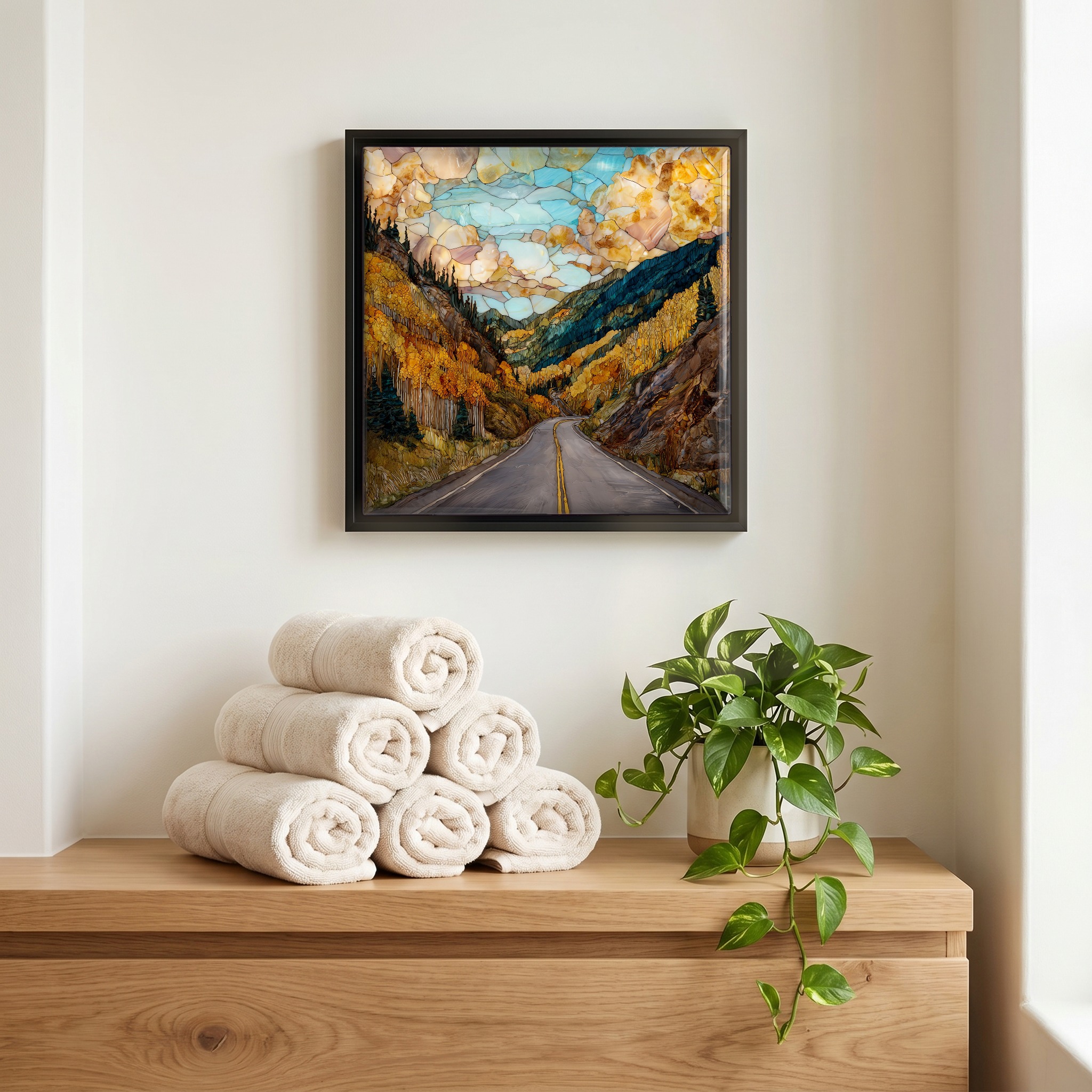 Above the linens, in a slim black surround.