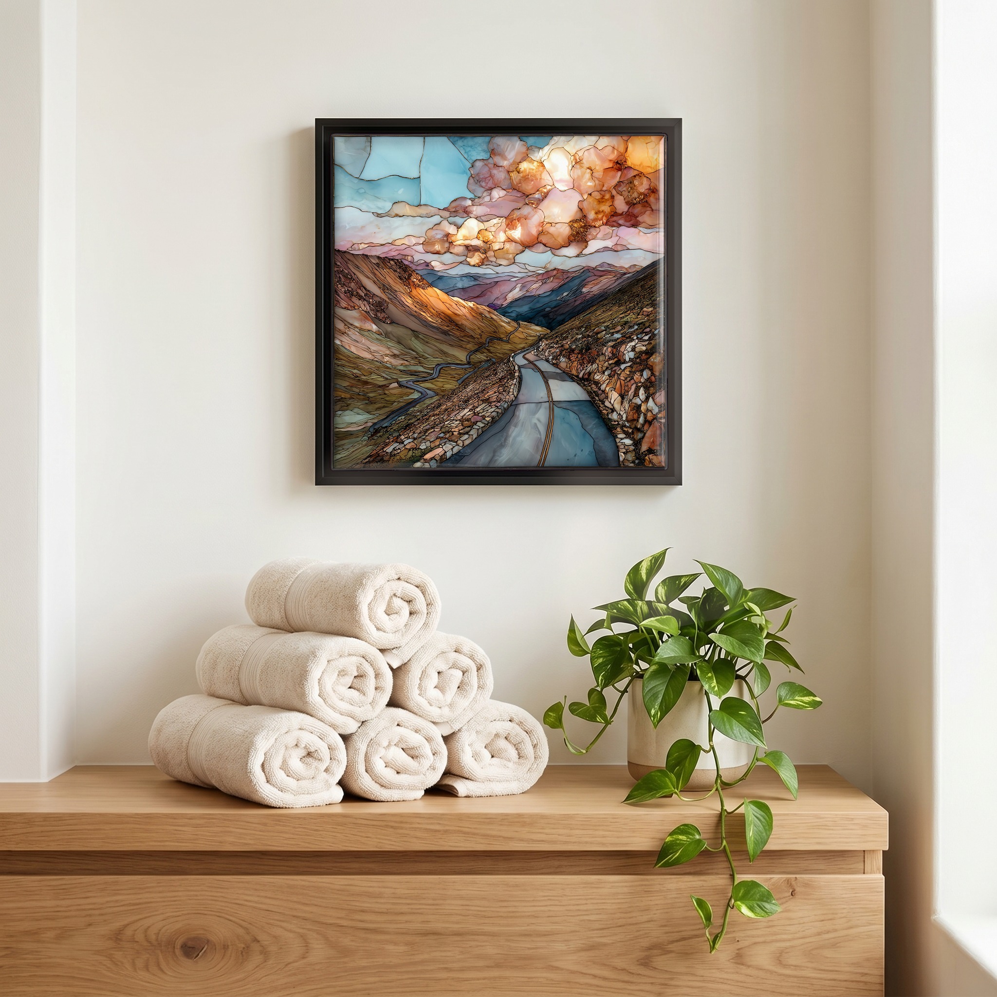 Above the linens, in a slim black surround.