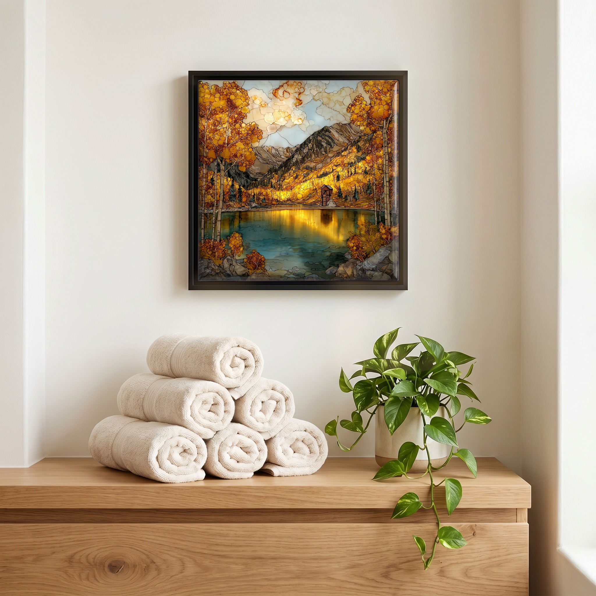 Above the linens, in a slim black surround.