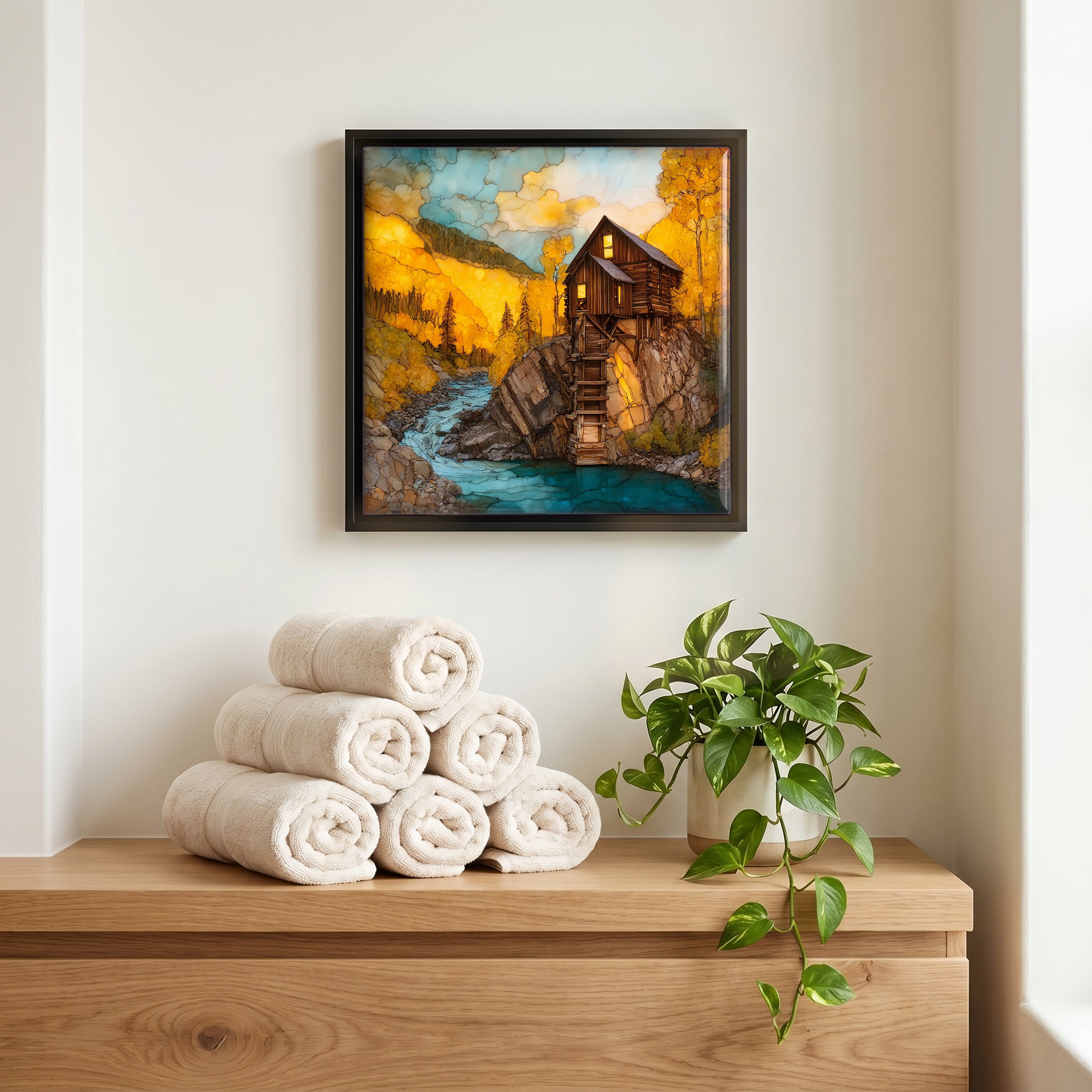 Above the linens, in a slim black surround.