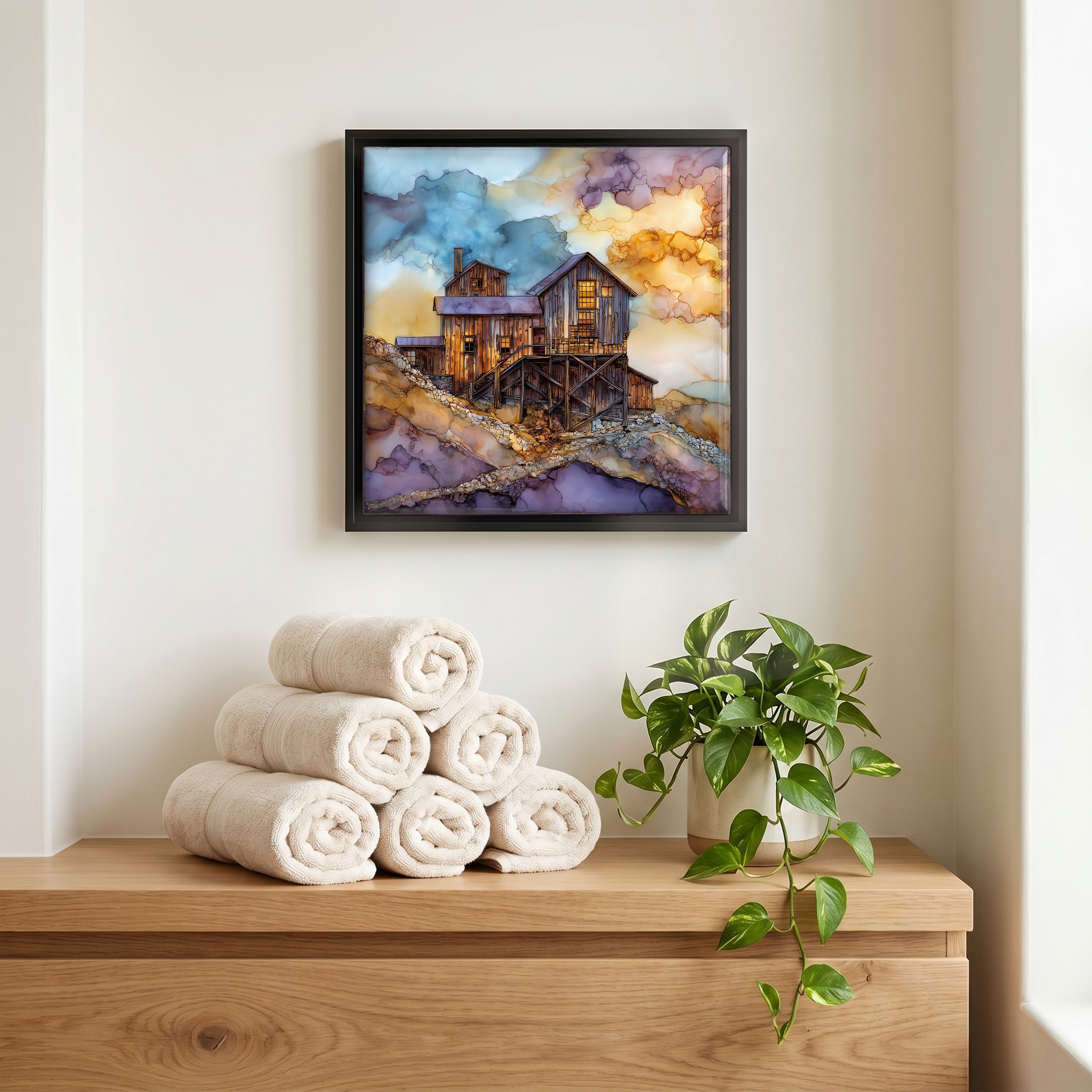 Above the linens, in a slim black surround.