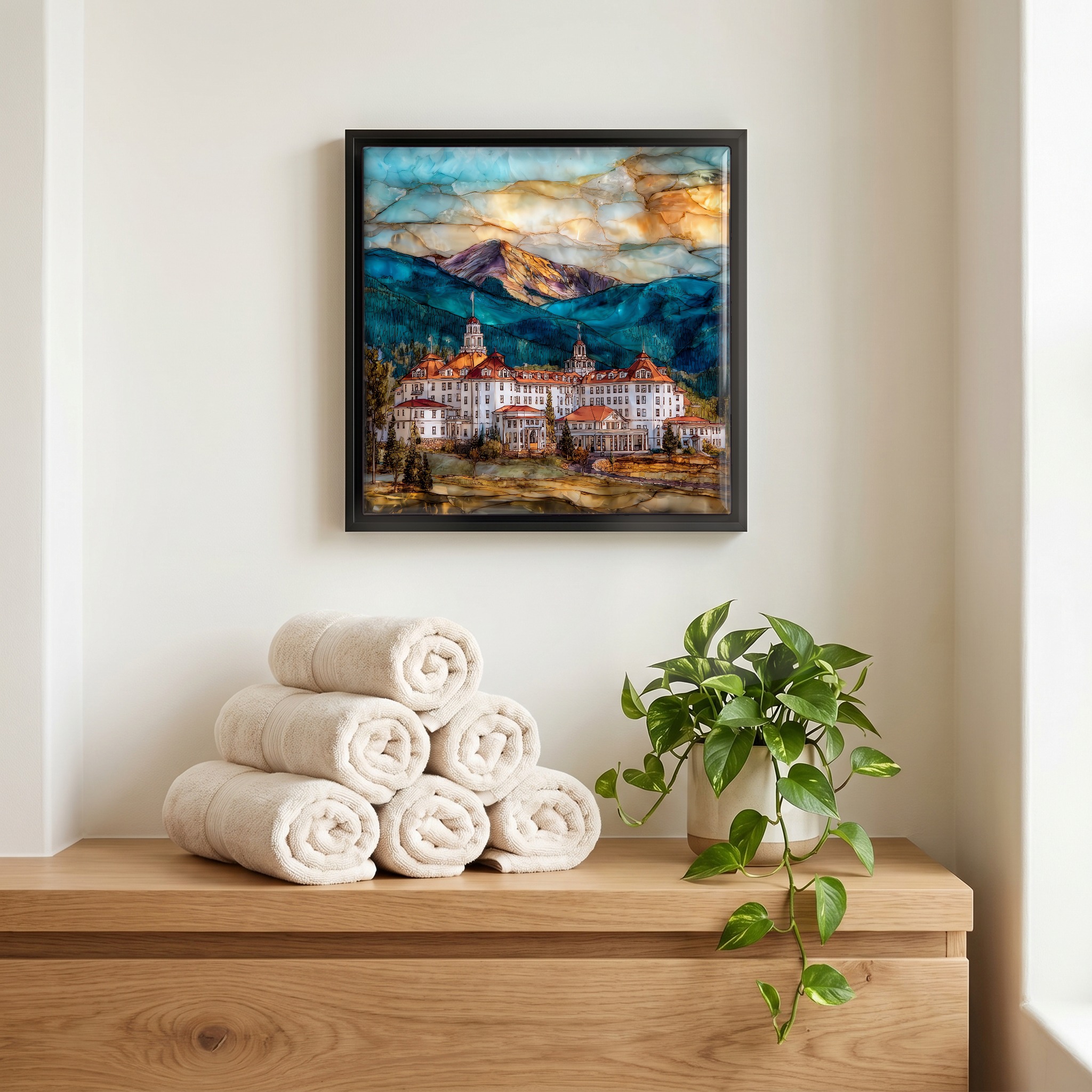 Above the linens, in a slim black surround.