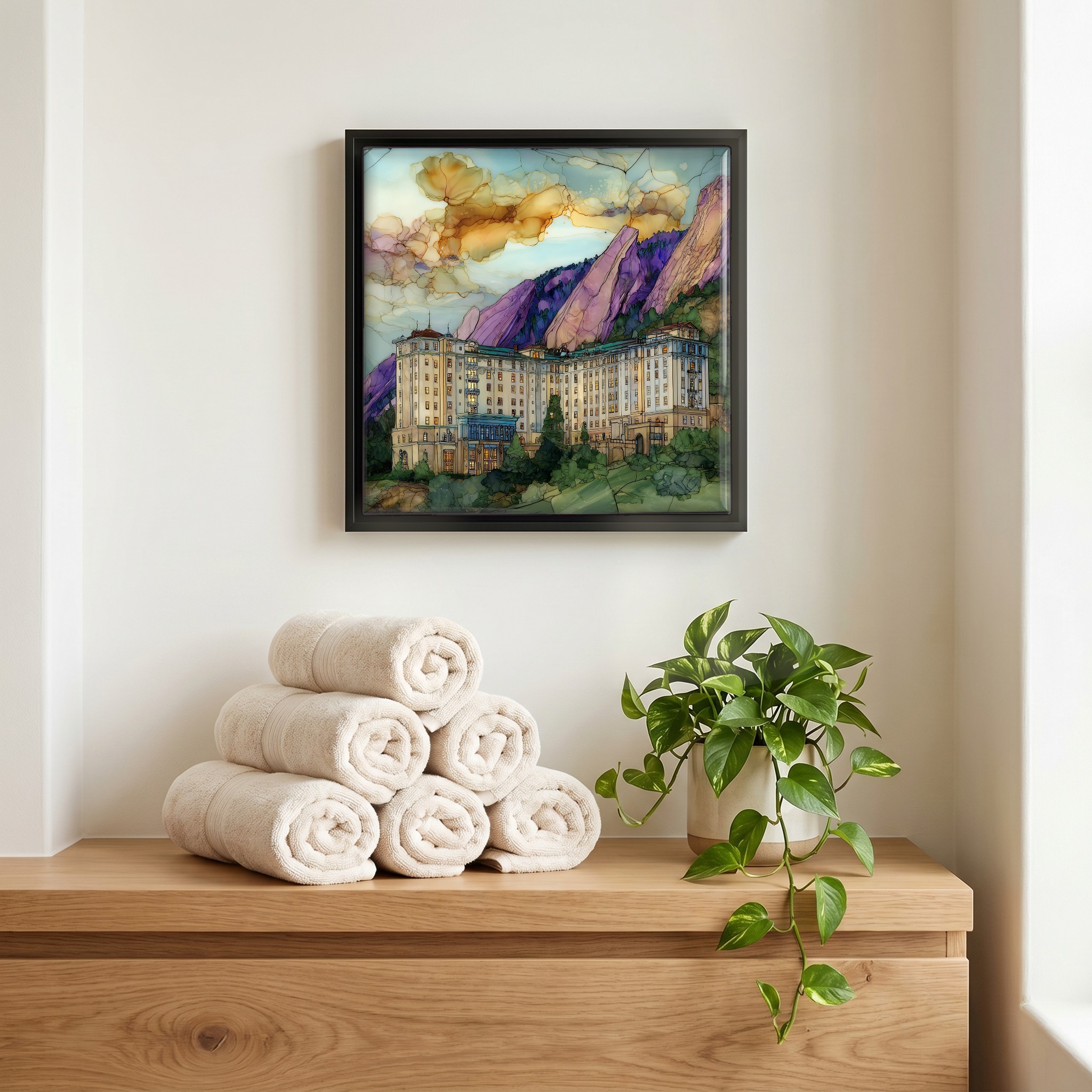 Above the linens, in a slim black surround.