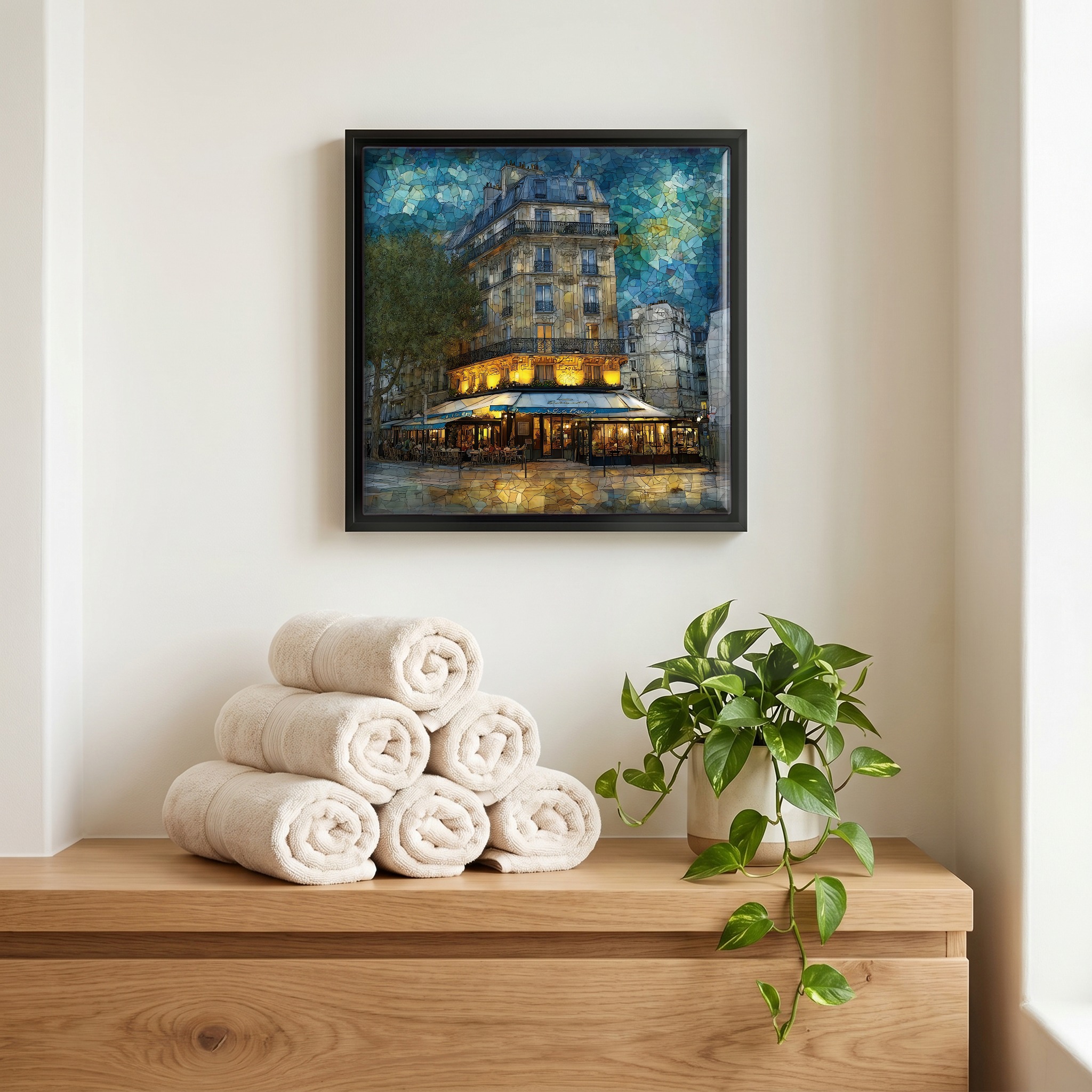 Above the linens, in a slim black surround.