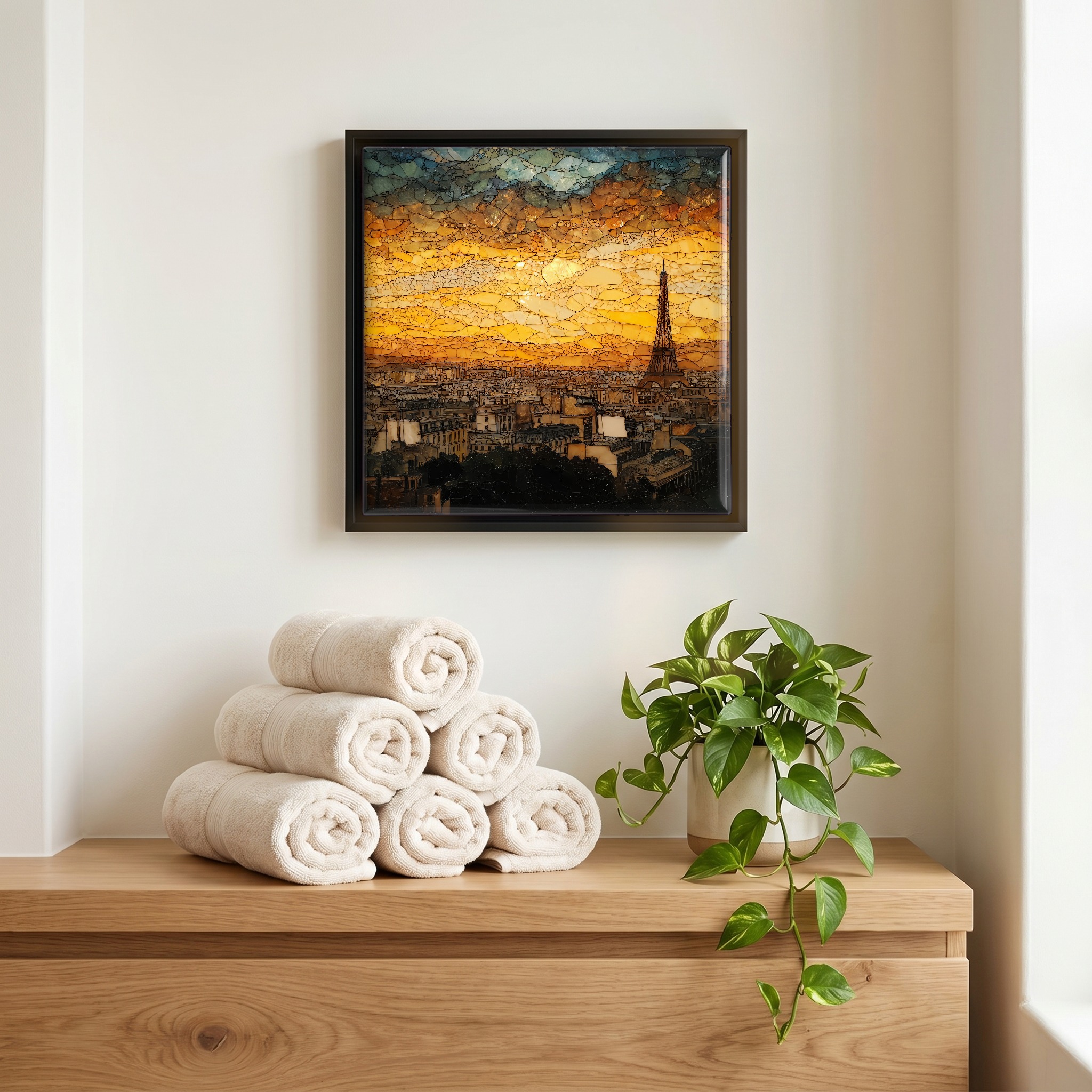 Above the linens, in a slim black surround.