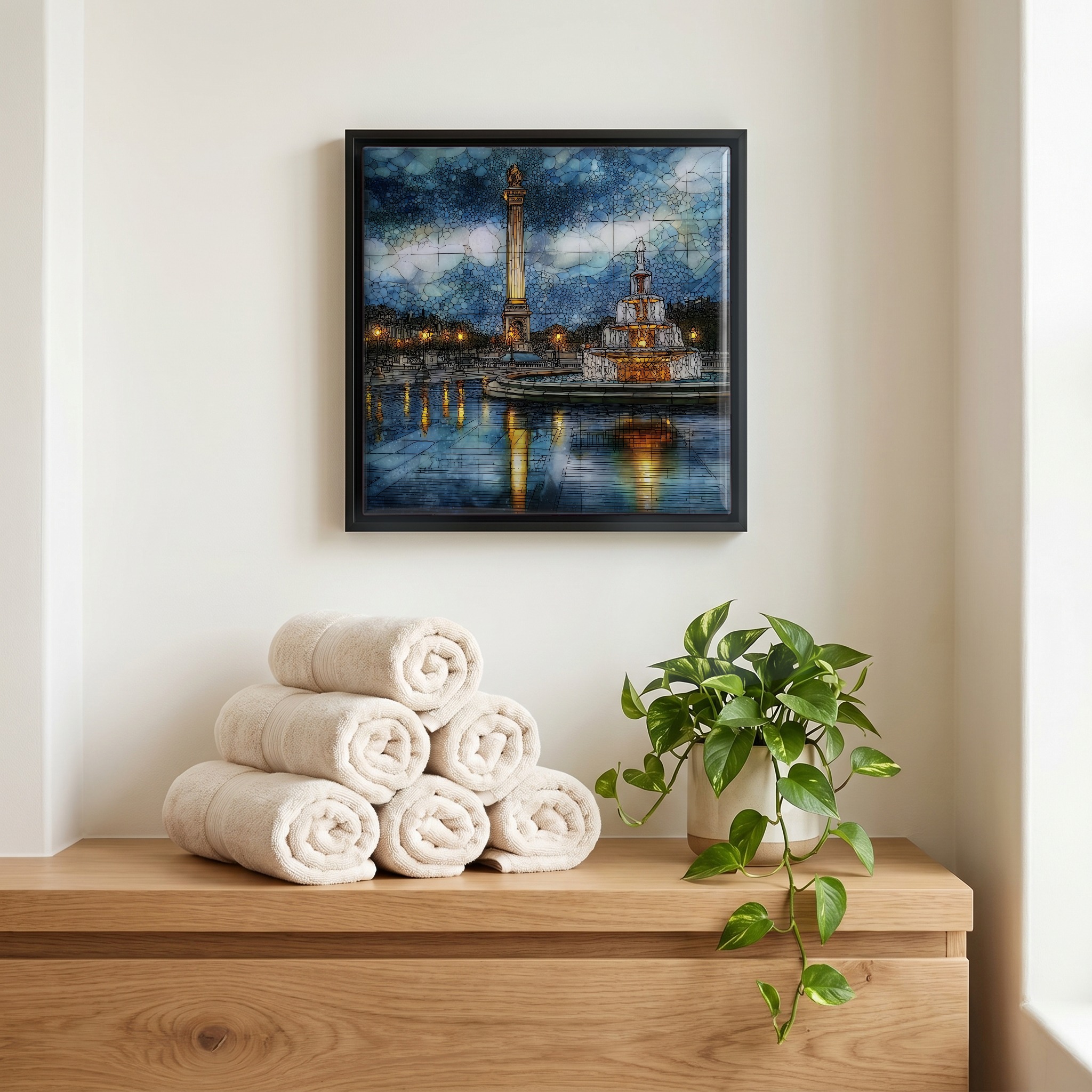 Above the linens, in a slim black surround.
