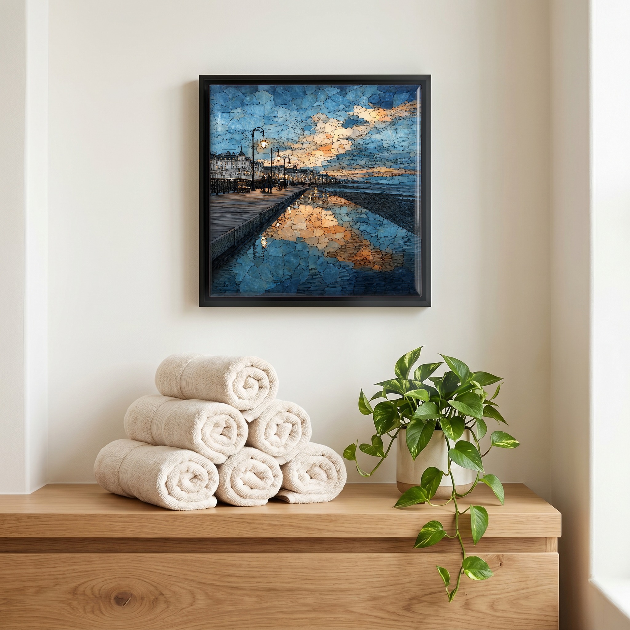 Above the linens, in a slim black surround.