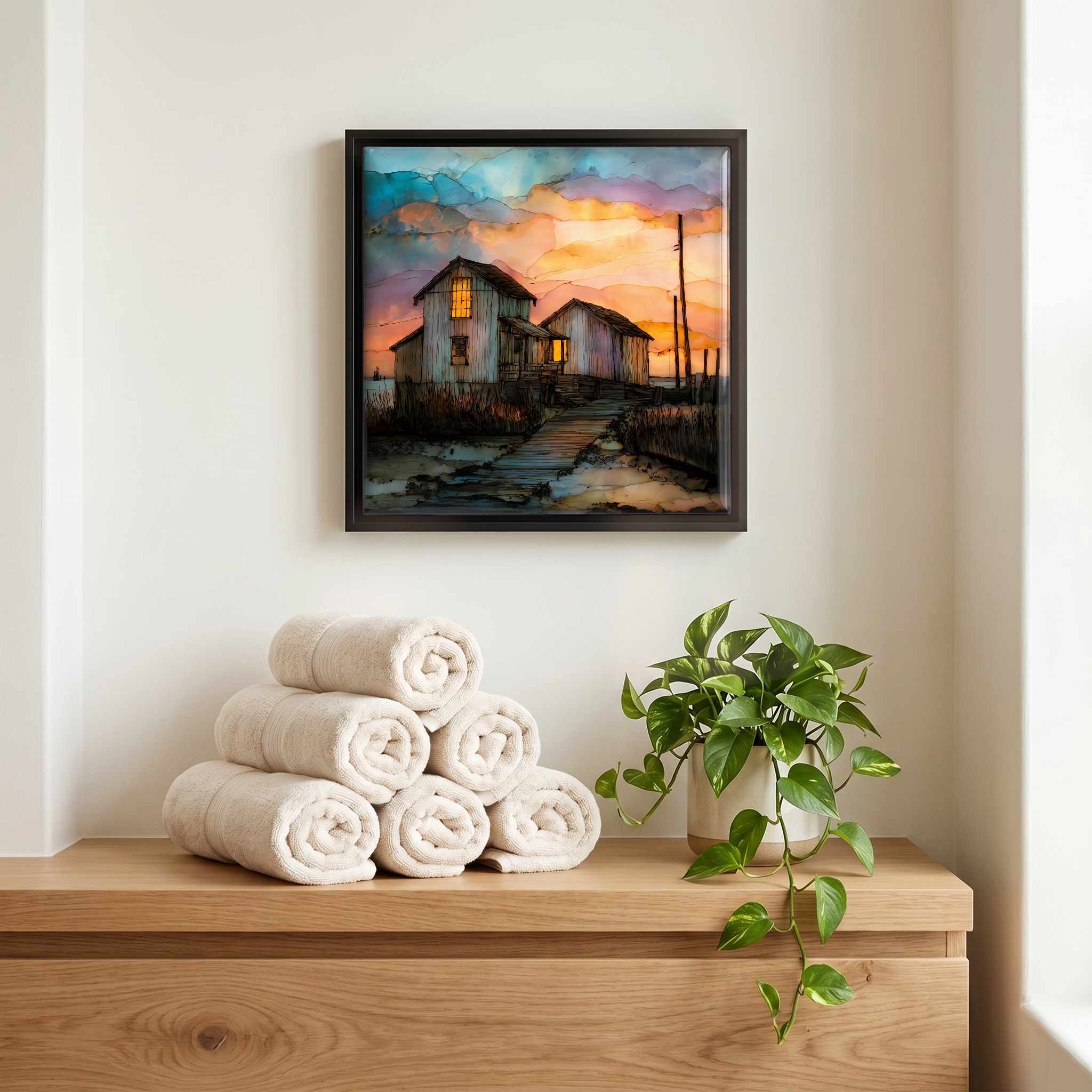 Above the linens, in a slim black surround.