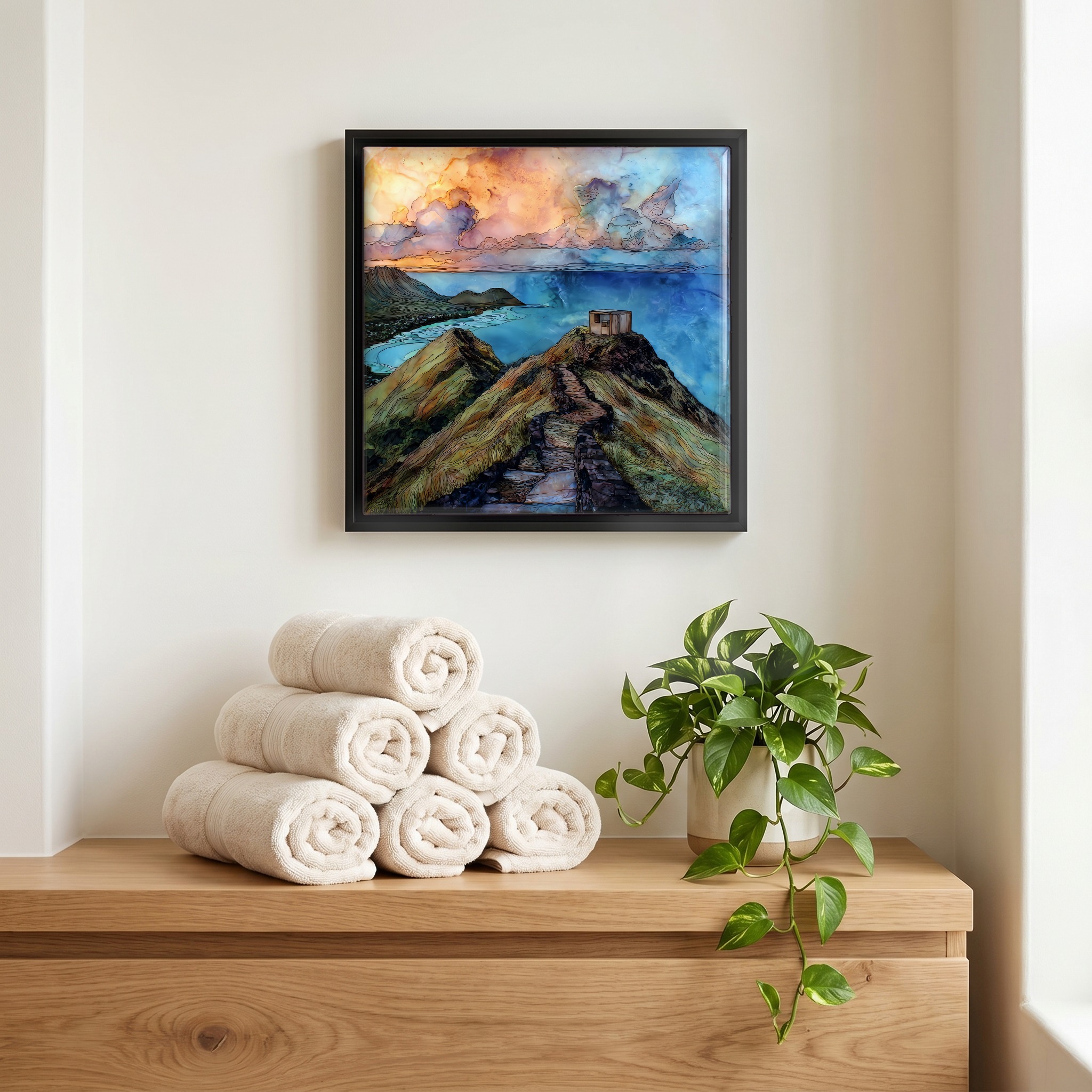 Above the linens, in a slim black surround.