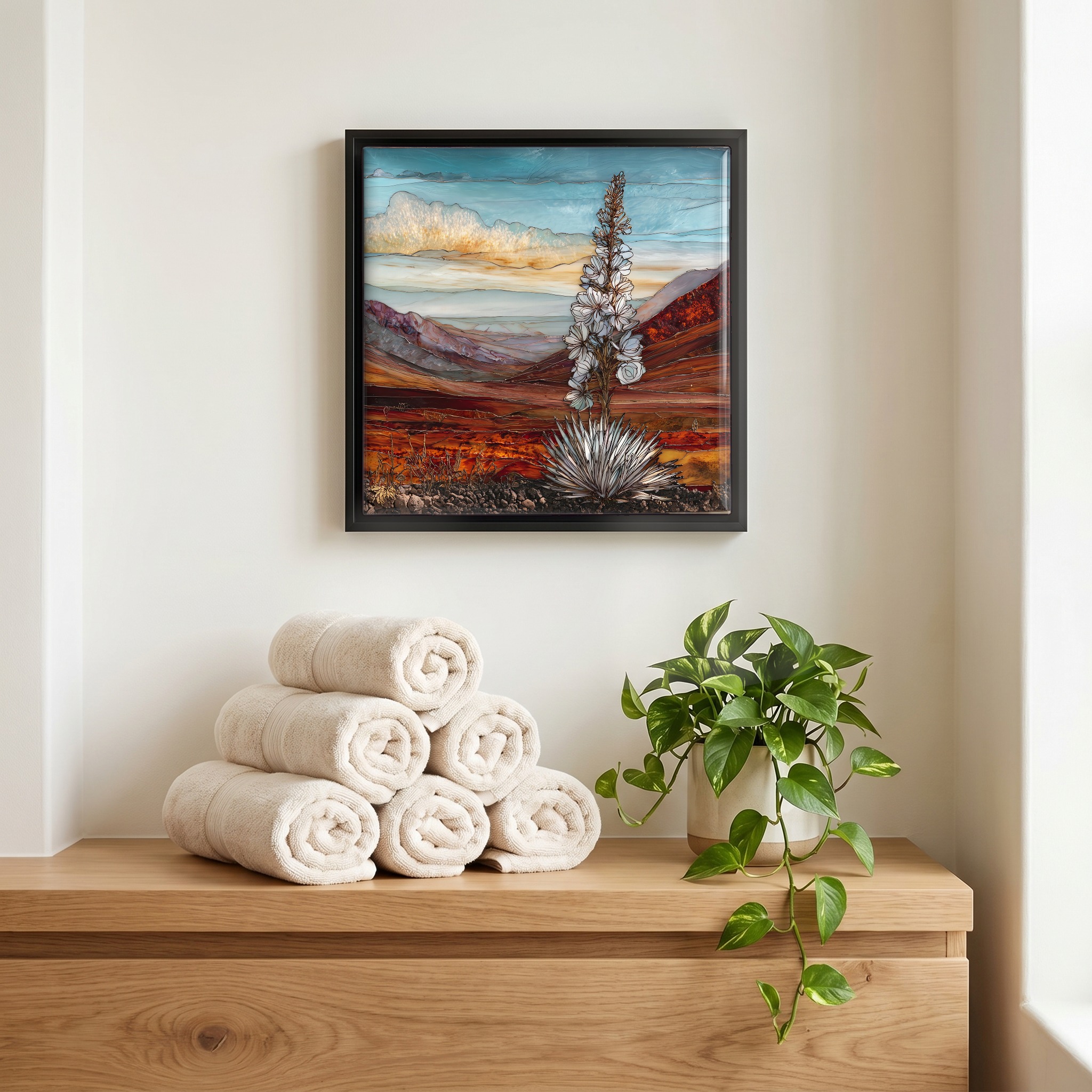 Above the linens, in a slim black surround.