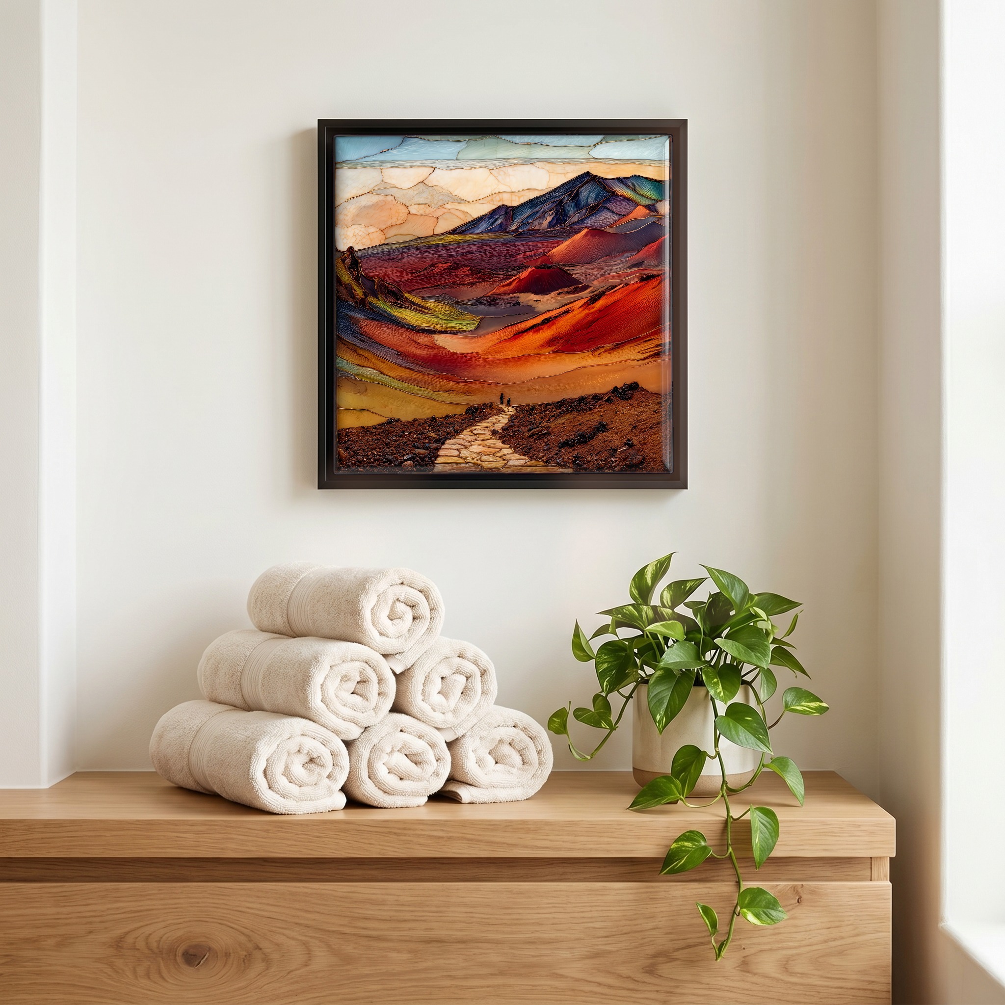 Above the linens, in a slim black surround.