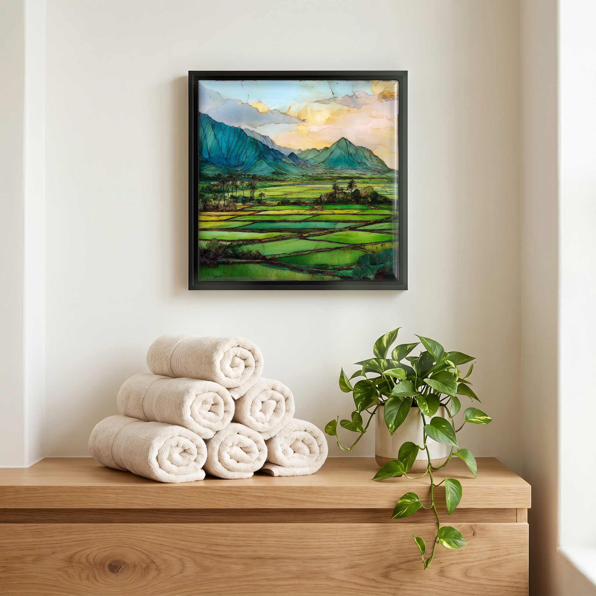 Above the linens, in a slim black surround.
