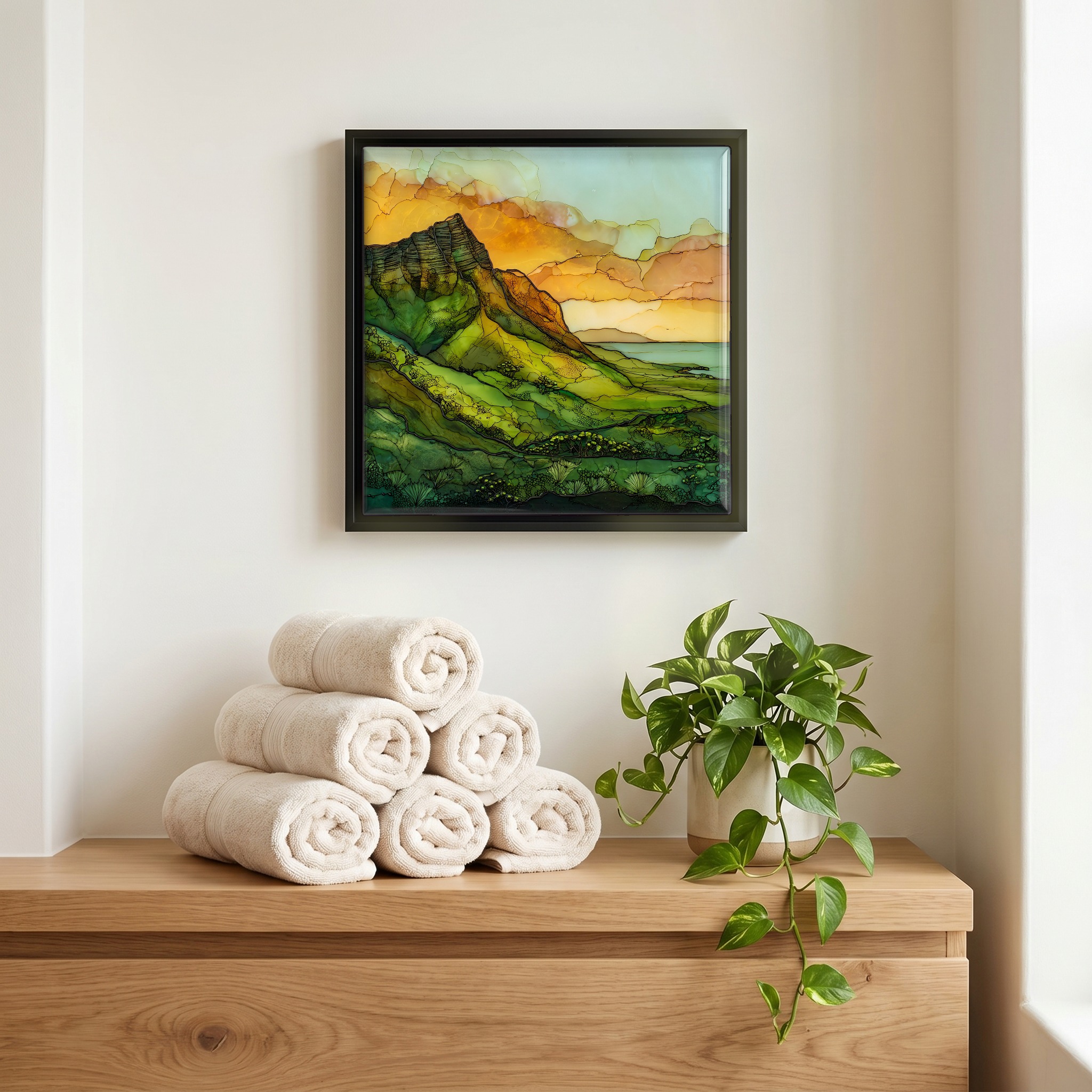 Above the linens, in a slim black surround.