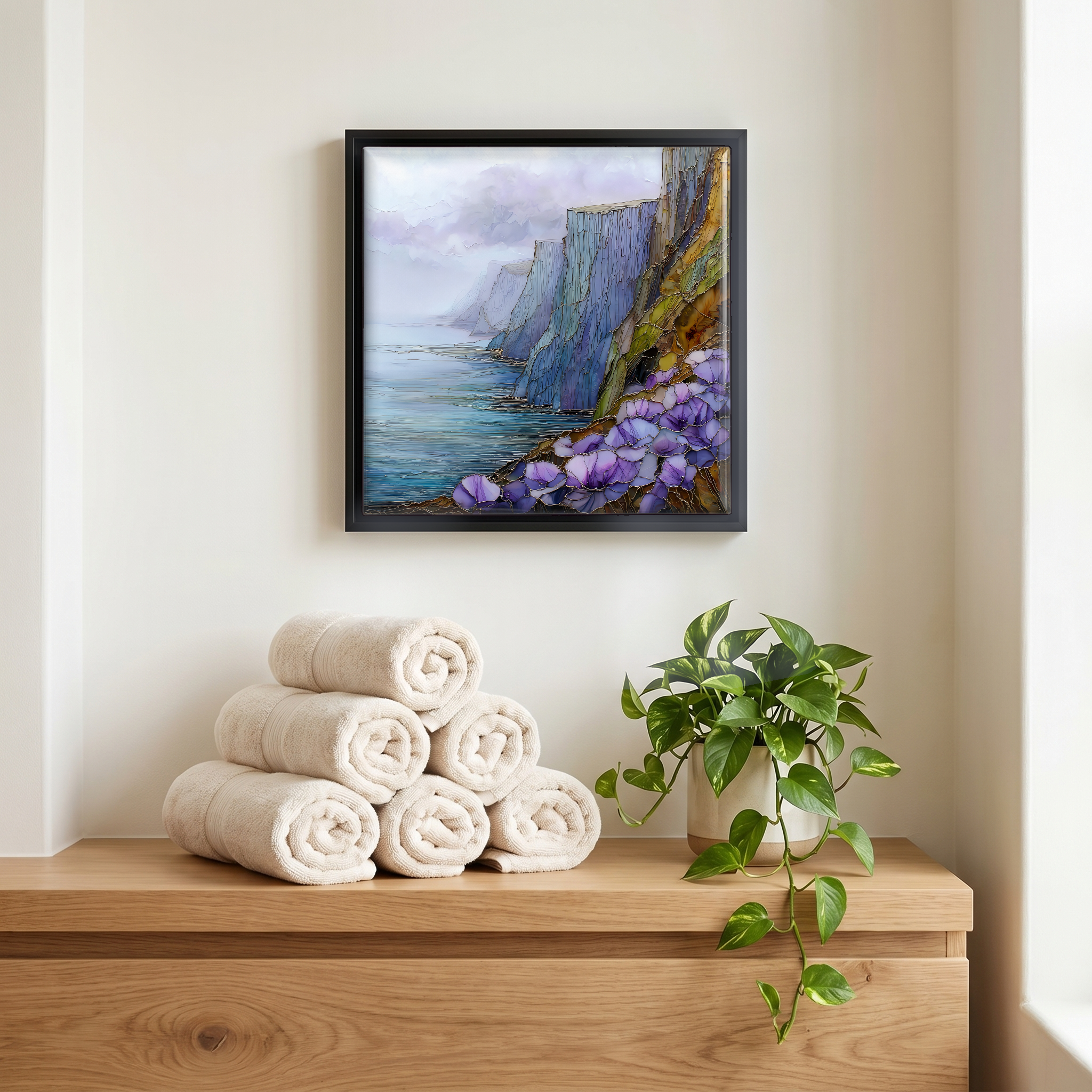 Above the linens, in a slim black surround.