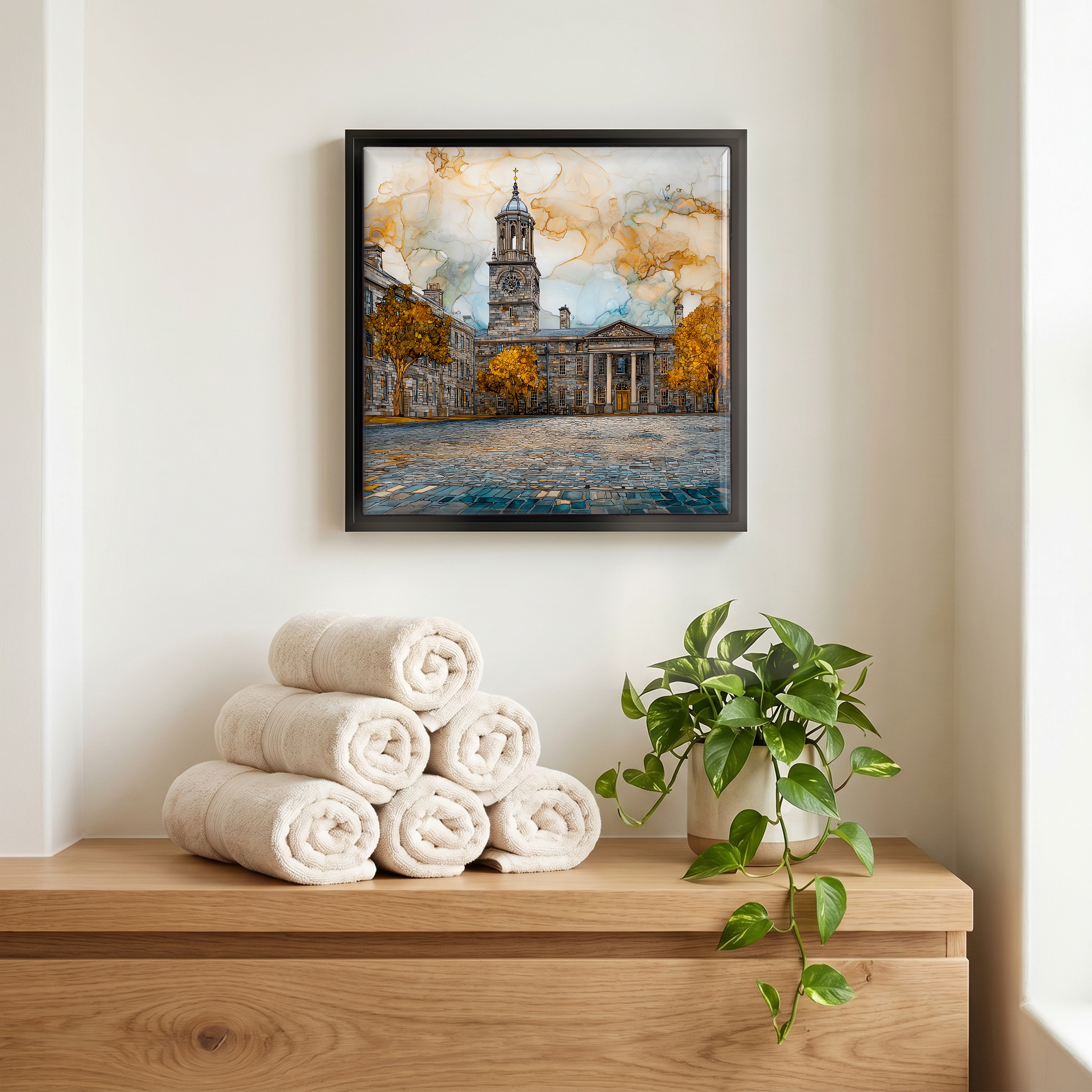 Above the linens, in a slim black surround.