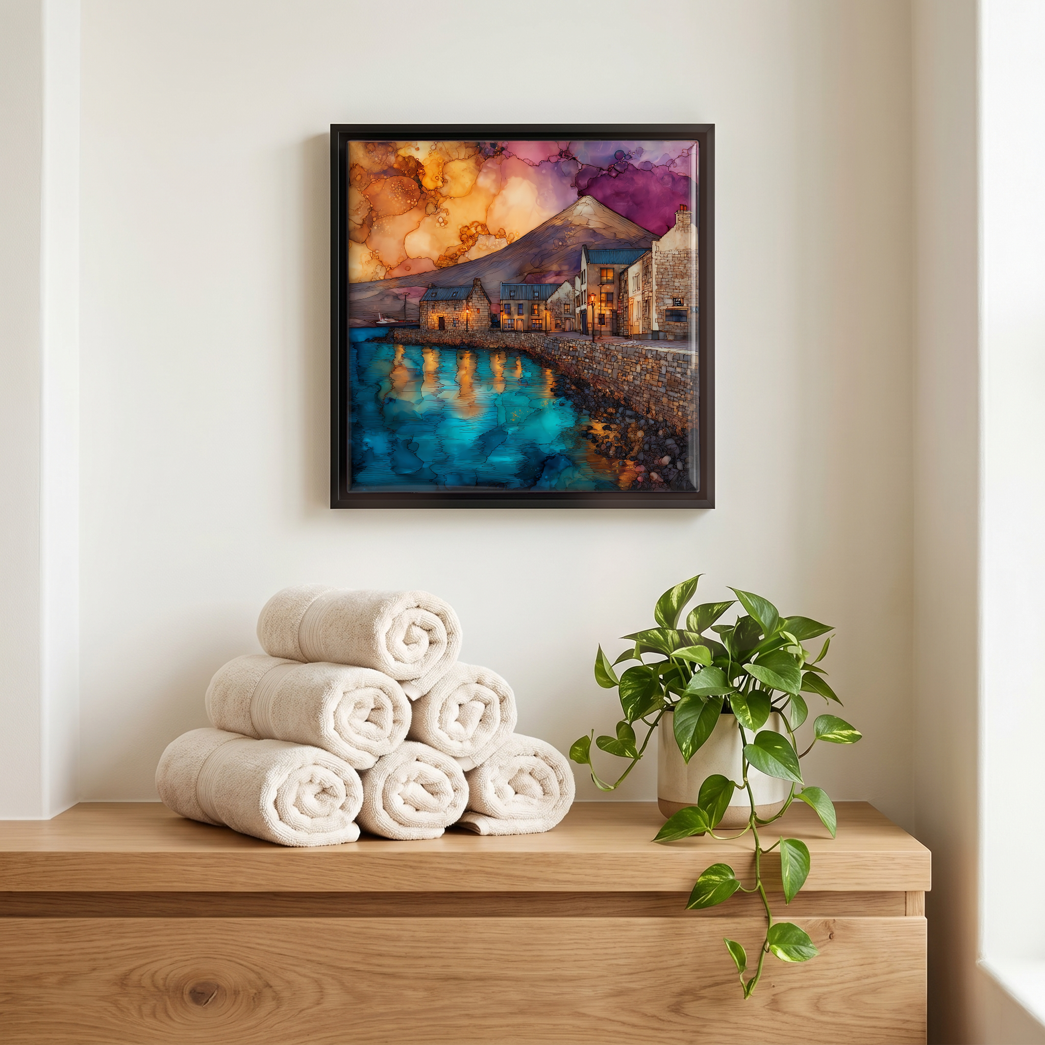 Above the linens, in a slim black surround.
