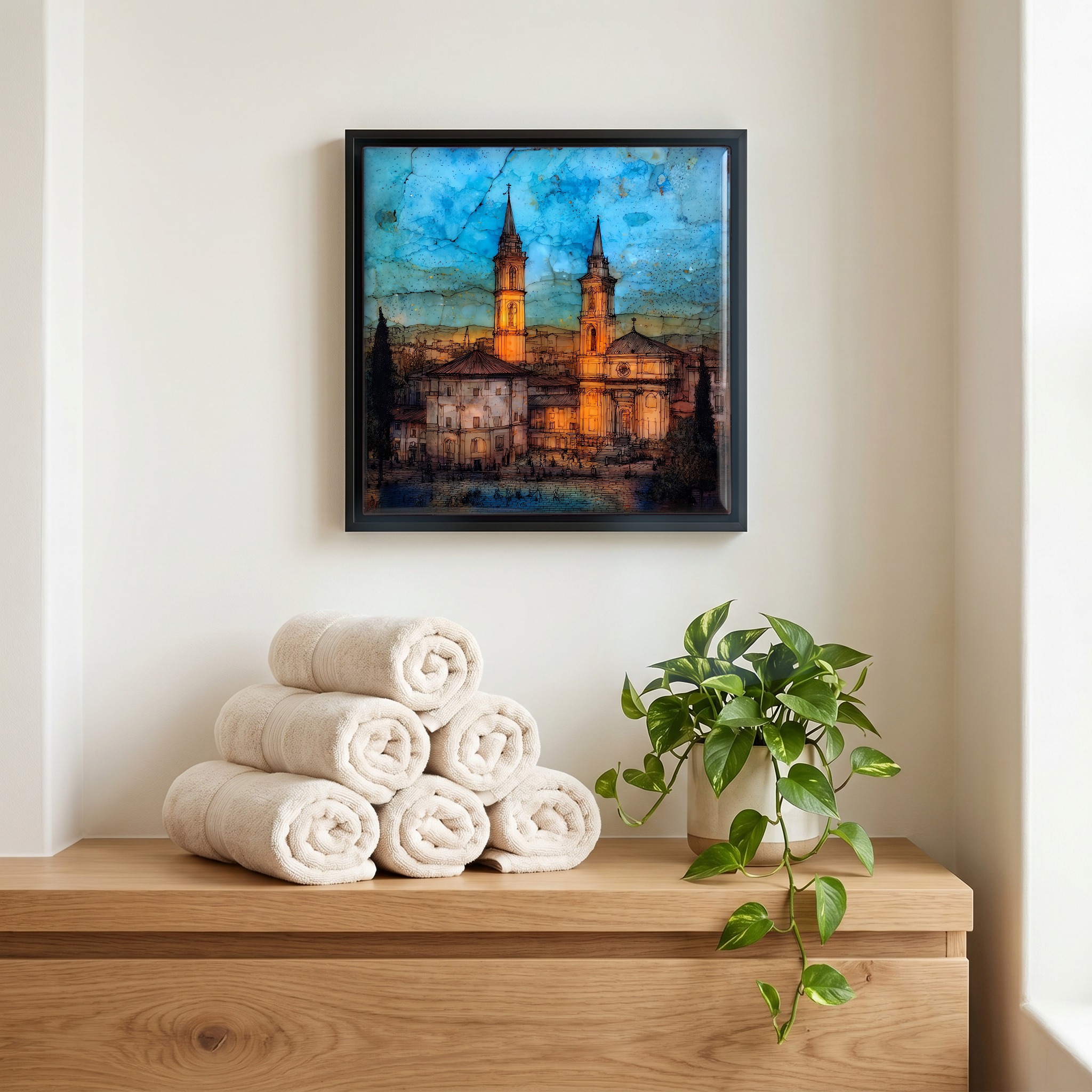 Above the linens, in a slim black surround.
