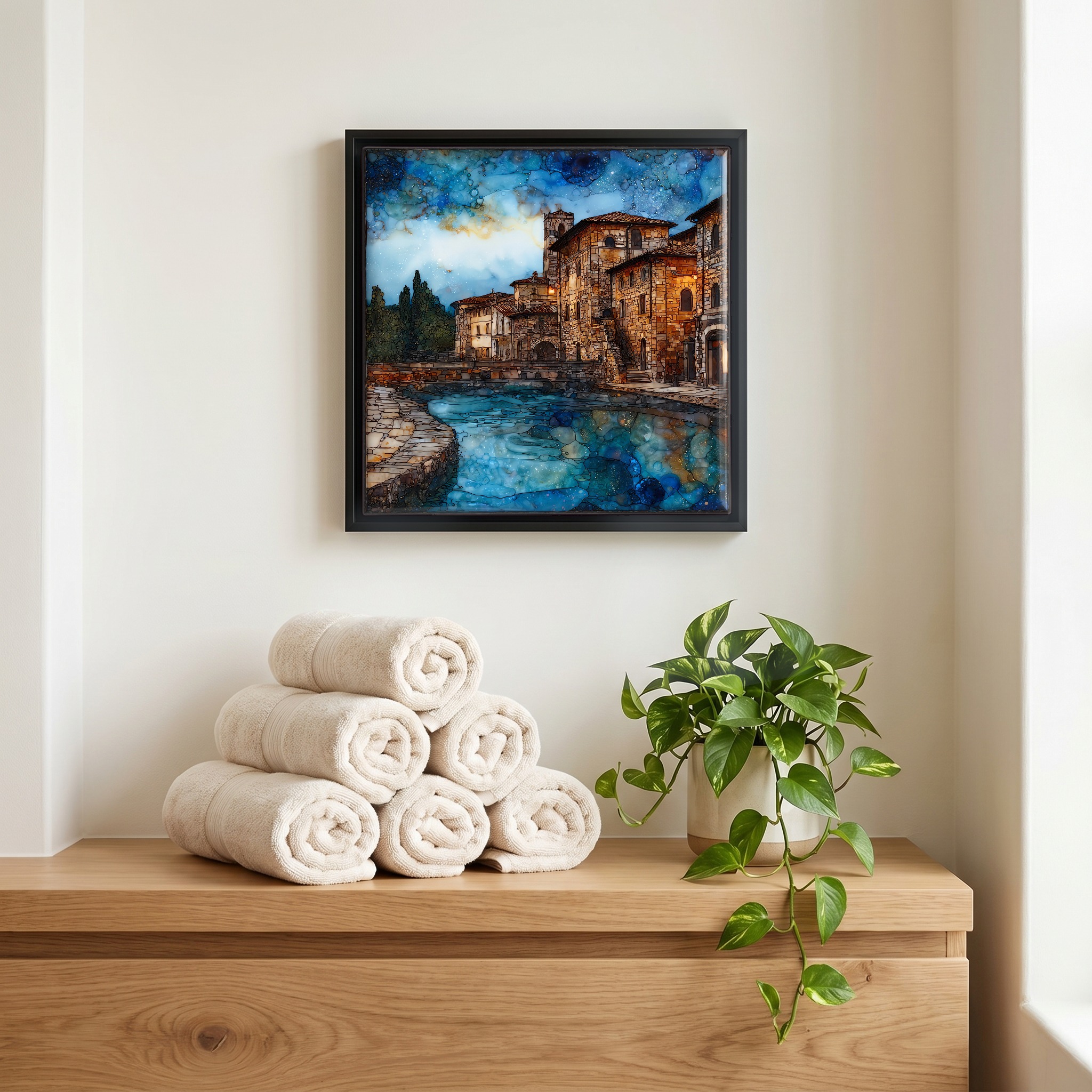 Above the linens, in a slim black surround.