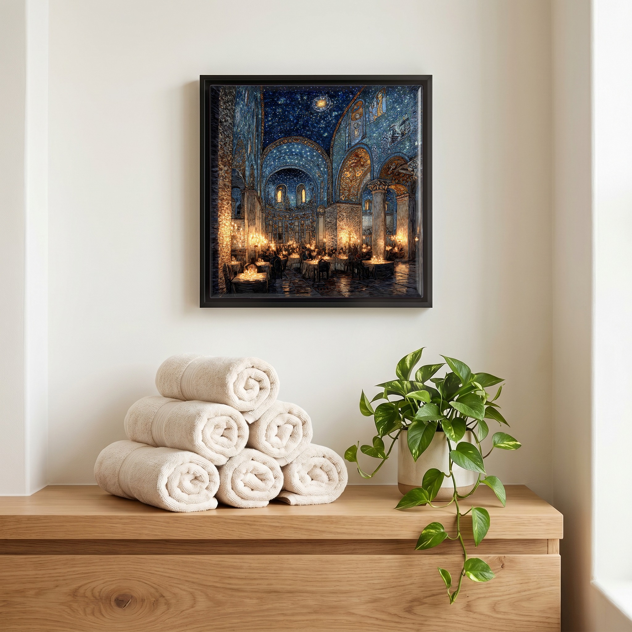 Above the linens, in a slim black surround.