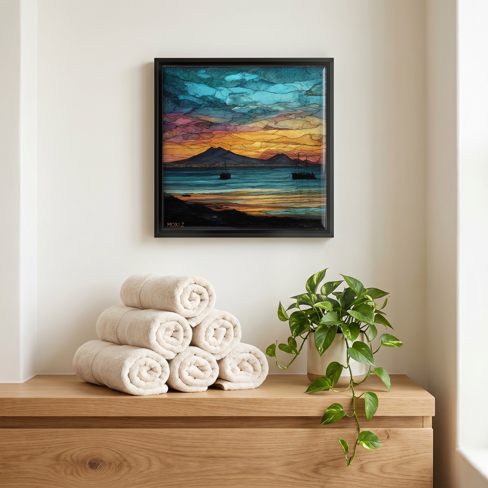 Above the linens, in a slim black surround.
