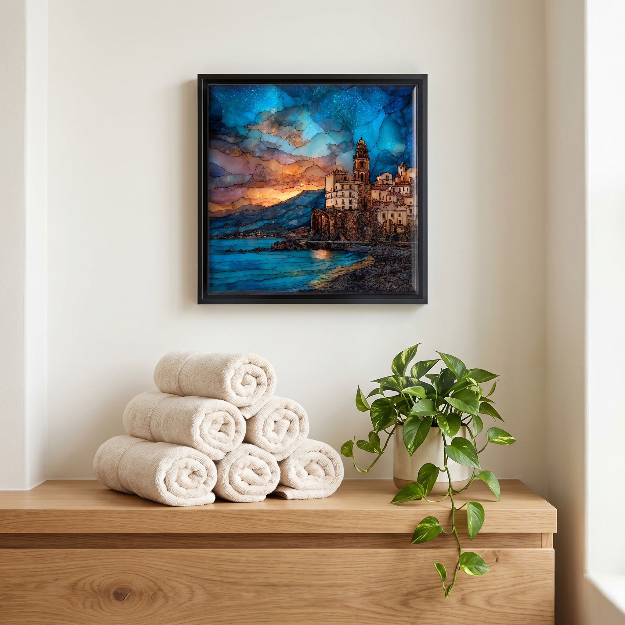 Above the linens, in a slim black surround.