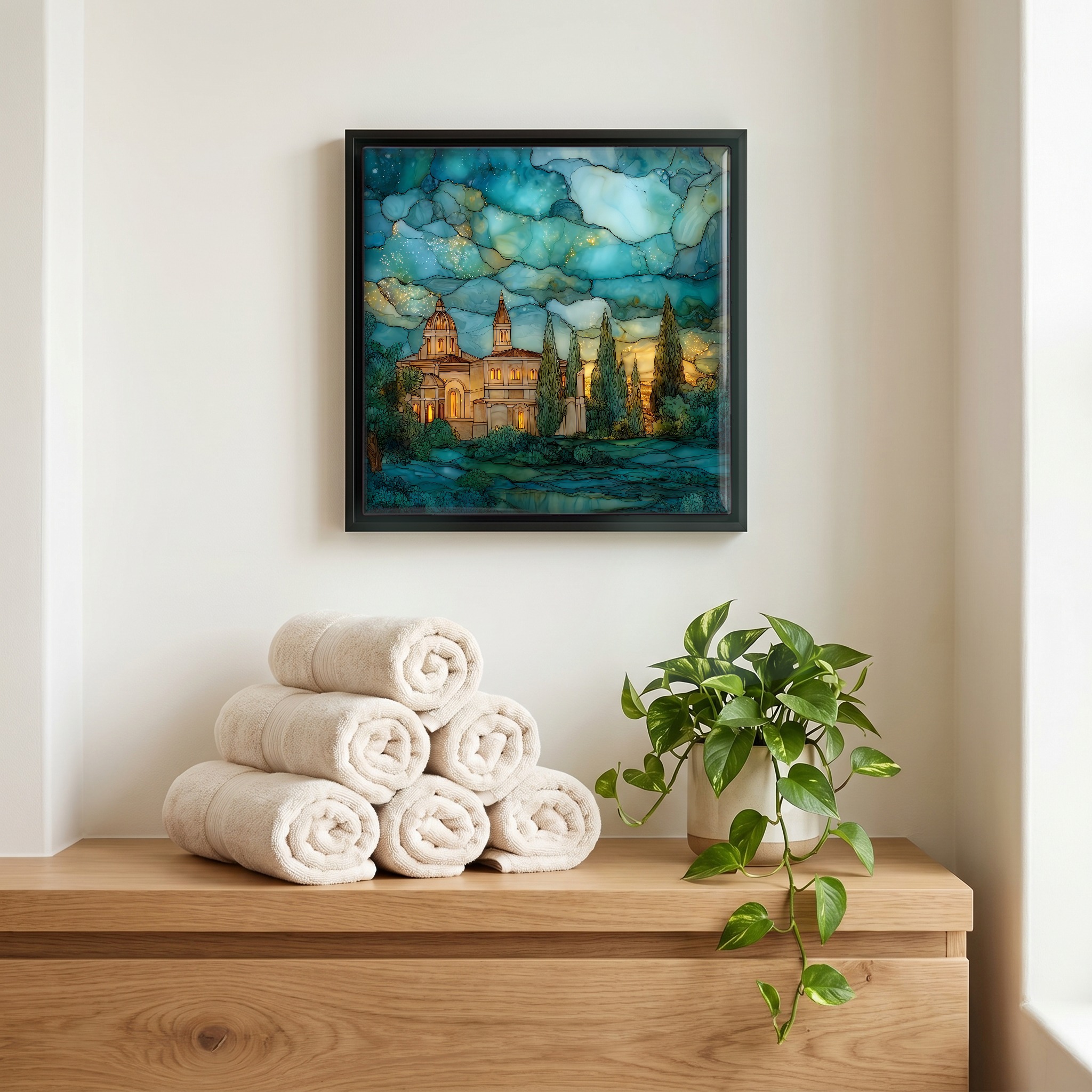 Above the linens, in a slim black surround.