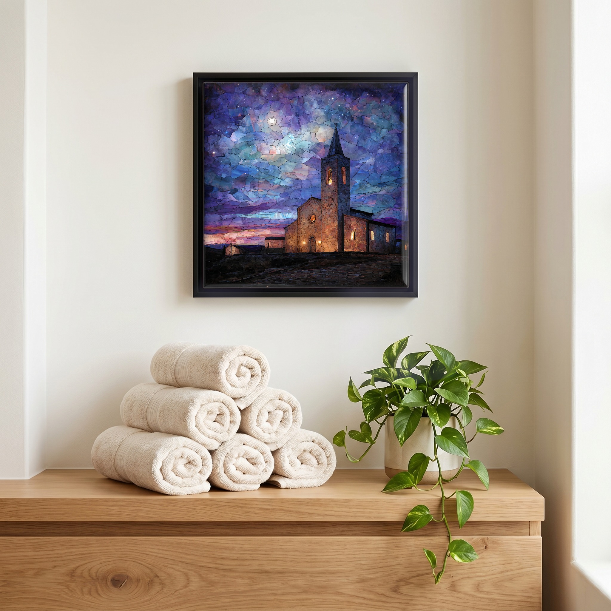 Above the linens, in a slim black surround.
