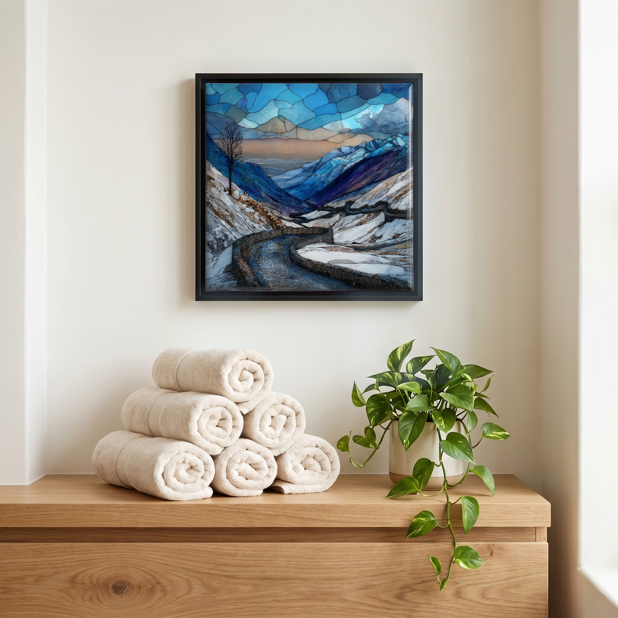 Above the linens, in a slim black surround.