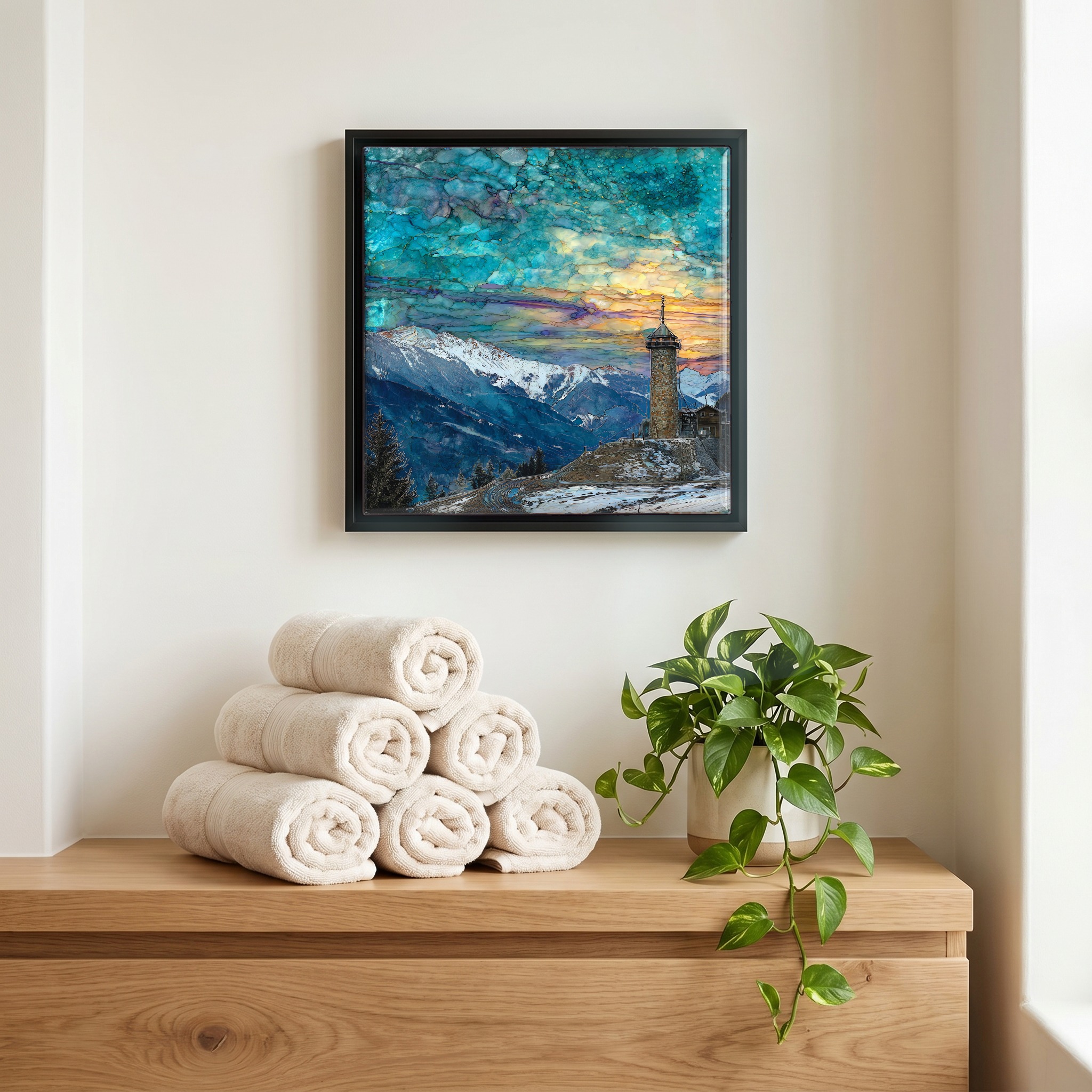 Above the linens, in a slim black surround.